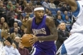 Nov 22, 2014; Minneapolis, MN, USA; Sacramento Kings center DeMarcus Cousins (15) drives to the basket through Minnesota Timberwolves forward Andrew Wiggins (22) in the first half at Target Center. Mandatory Credit: Jesse Johnson-USA TODAY Sports