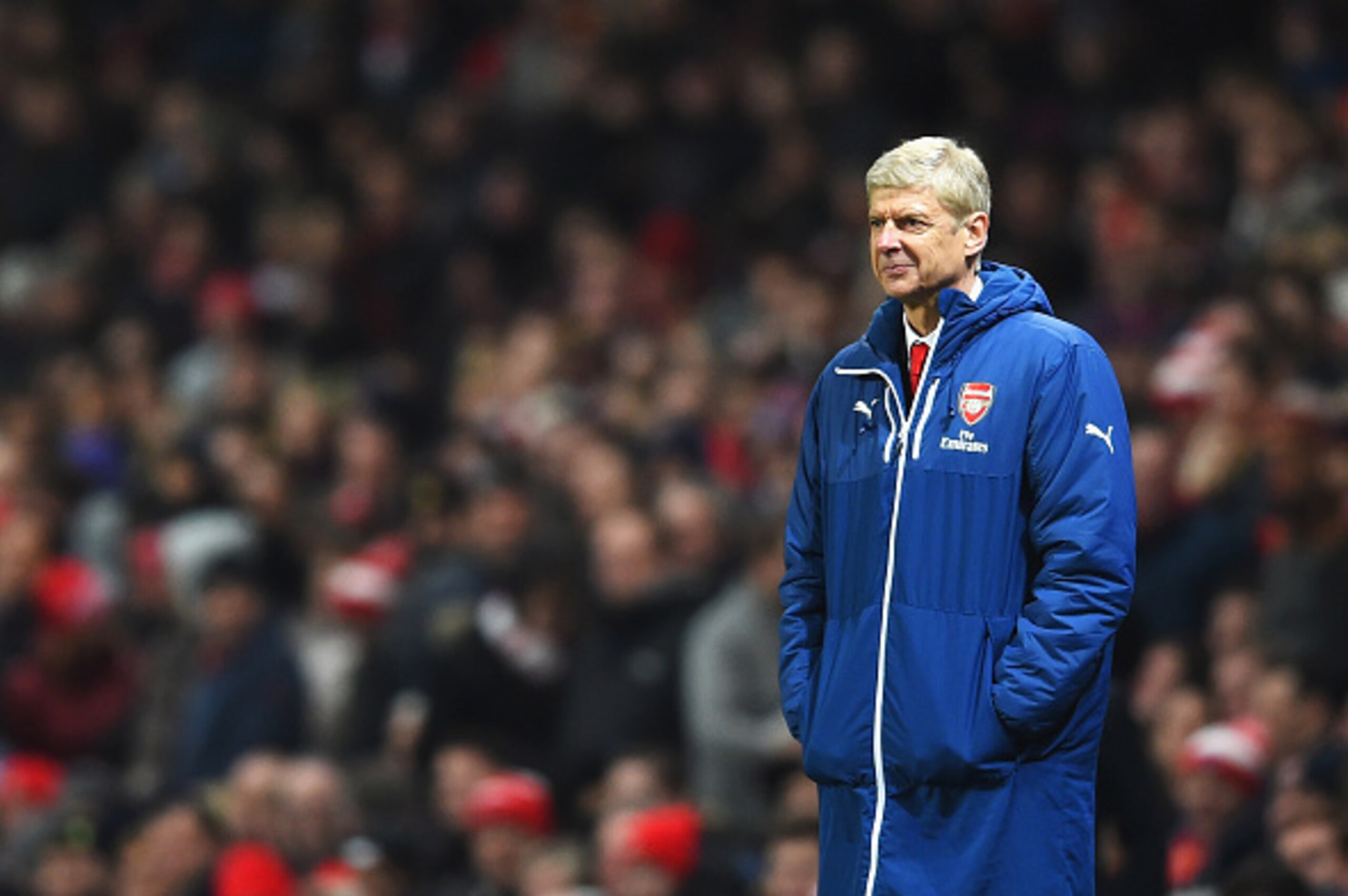 LONDON, ENGLAND - DECEMBER 13:  Arsene Wenger, manager of Arsenal smiles after the second goal of Olivier Giroud of Arsenal during the Barclays Premier League match between Arsenal and Newcastle United at Emirates Stadium on December 13, 2014 in London, E