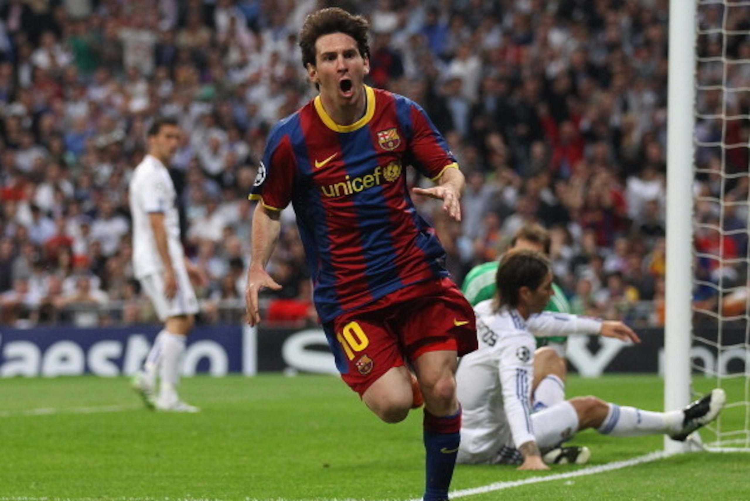 MADRID, SPAIN - APRIL 27: Lionel Messi of Barcelona celebrates after scoring his first goal during the UEFA Champions League Semi Final first leg match between Real Madrid and Barcelona at Estadio Santiago Bernabeu on April 27, 2011 in Madrid, Spain. (Pho