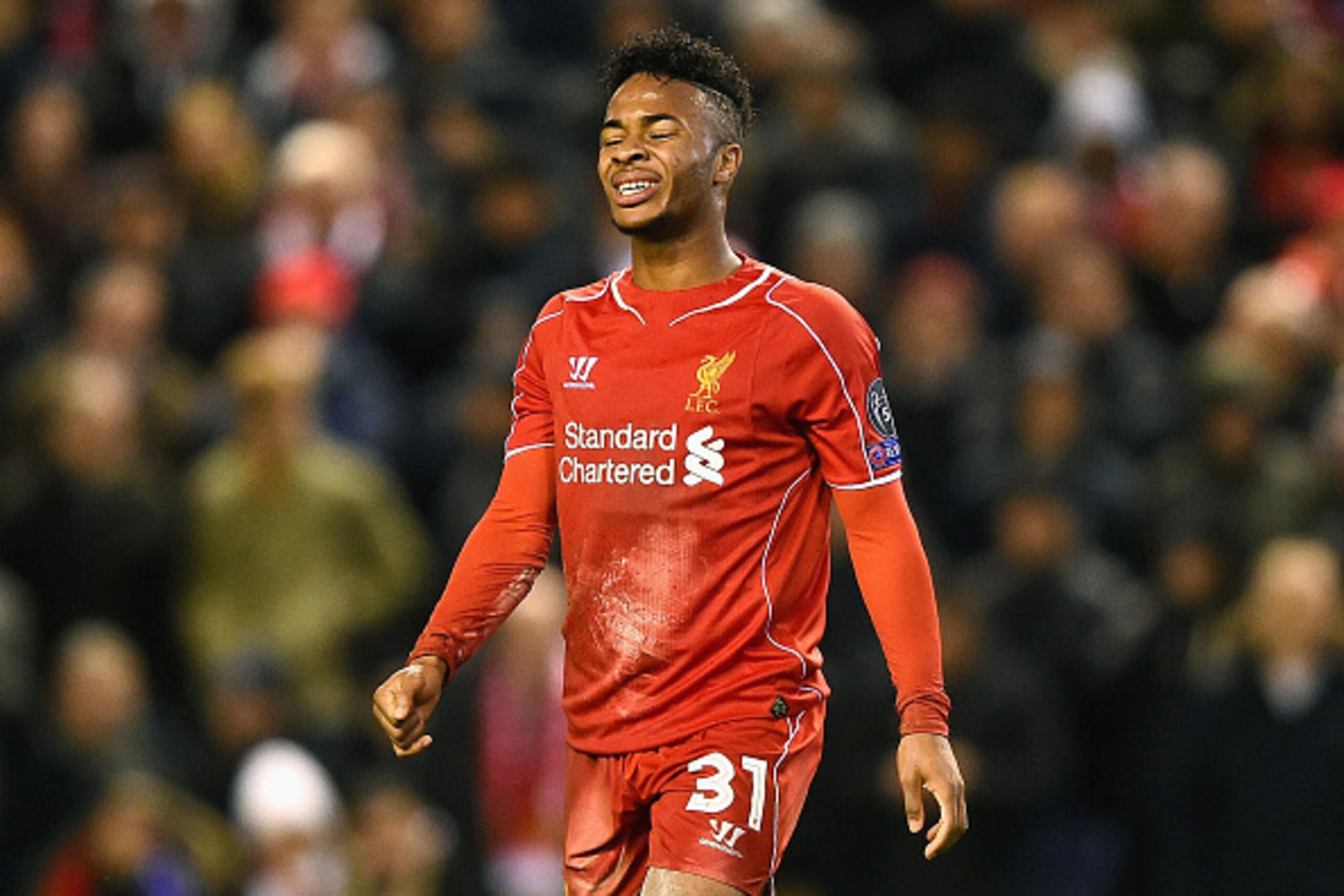 LIVERPOOL, ENGLAND - DECEMBER 09: A dejected Raheem Sterling of Liverpool reacts following his team's 1-1 draw and exit from the competition during the UEFA Champions League group B match between Liverpool and FC Basel 1893 at Anfield on December 9, 2014 LIVERPOOL, ENGLAND - DECEMBER 09: A dejected Raheem Sterling of Liverpool reacts following his team's 1-1 draw and exit from the competition during the UEFA Champions League group B match between Liverpool and FC Basel 1893 at Anfield on December 9, 2014