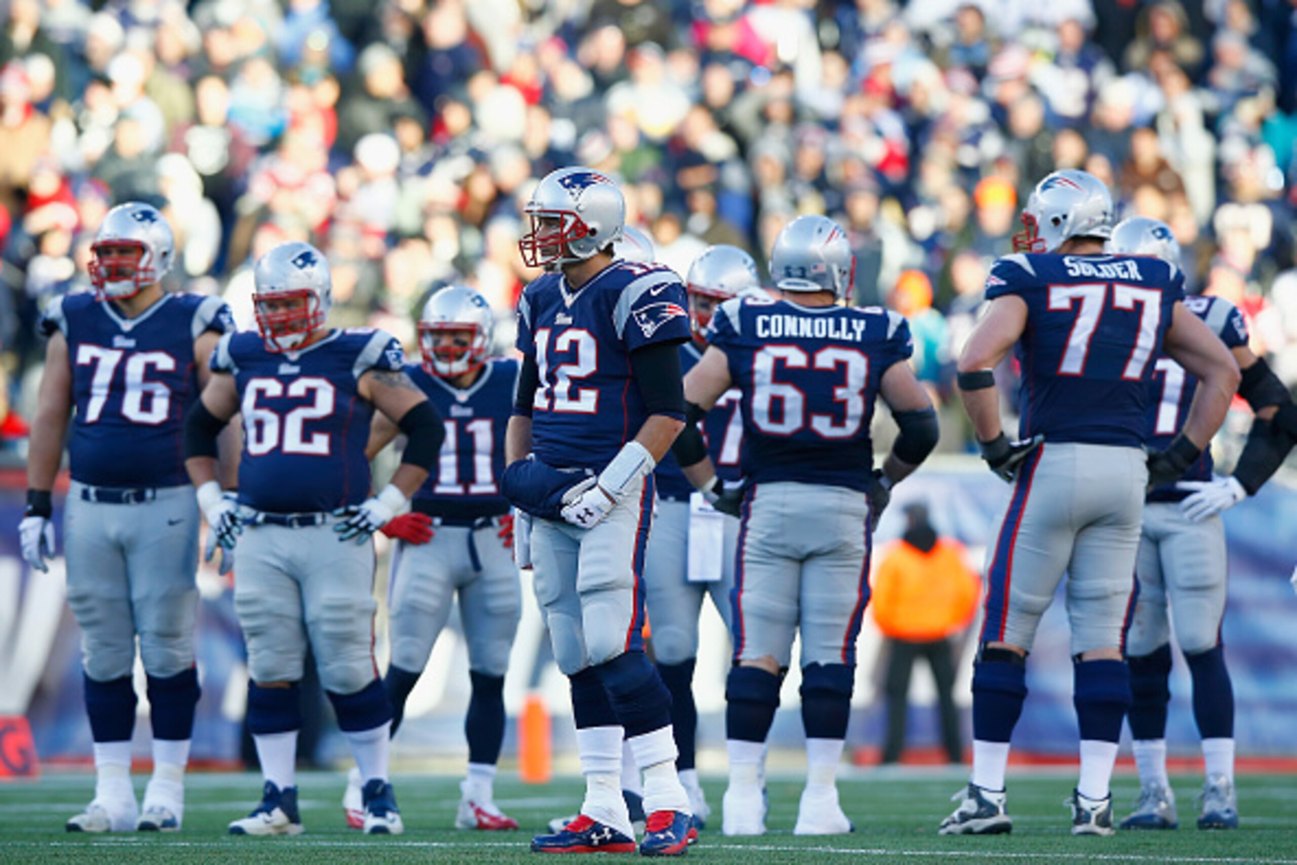 FOXBORO, MA - DECEMBER 14:  Tom Brady #12 of the New England Patriots looks on during the third quarter against the Miami Dolphins at Gillette Stadium on December 14, 2014 in Foxboro, Massachusetts.  (Photo by Jared Wickerham/Getty Images)