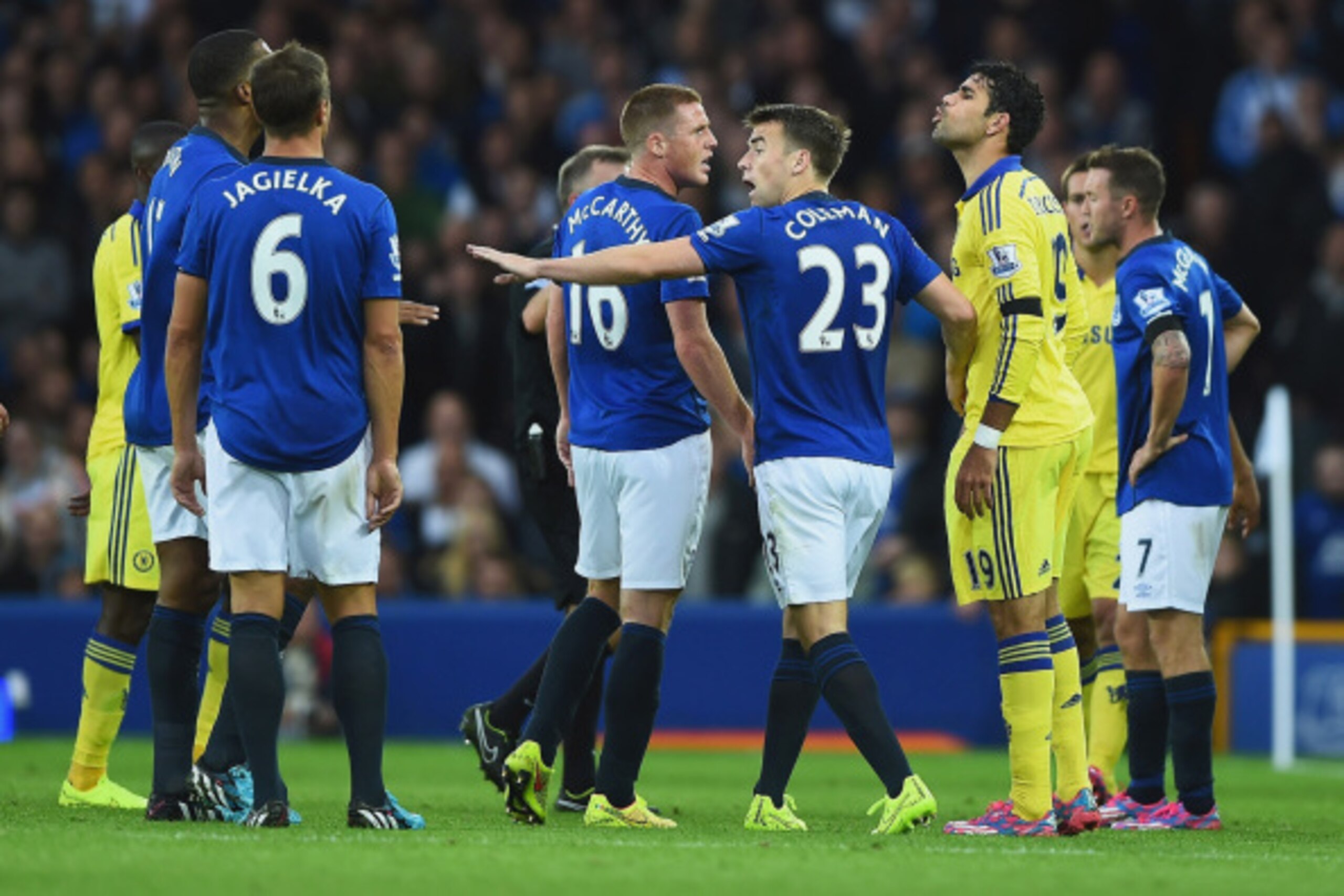 LIVERPOOL, ENGLAND - AUGUST 30: Diego Costa of Chelsea exchanges words with Sylvain Distin of Everton as Seamus Coleman of Everton intervenes during the Barclays Premier League match between Everton and Chelsea at Goodison Park on August 30, 2014 in Liver