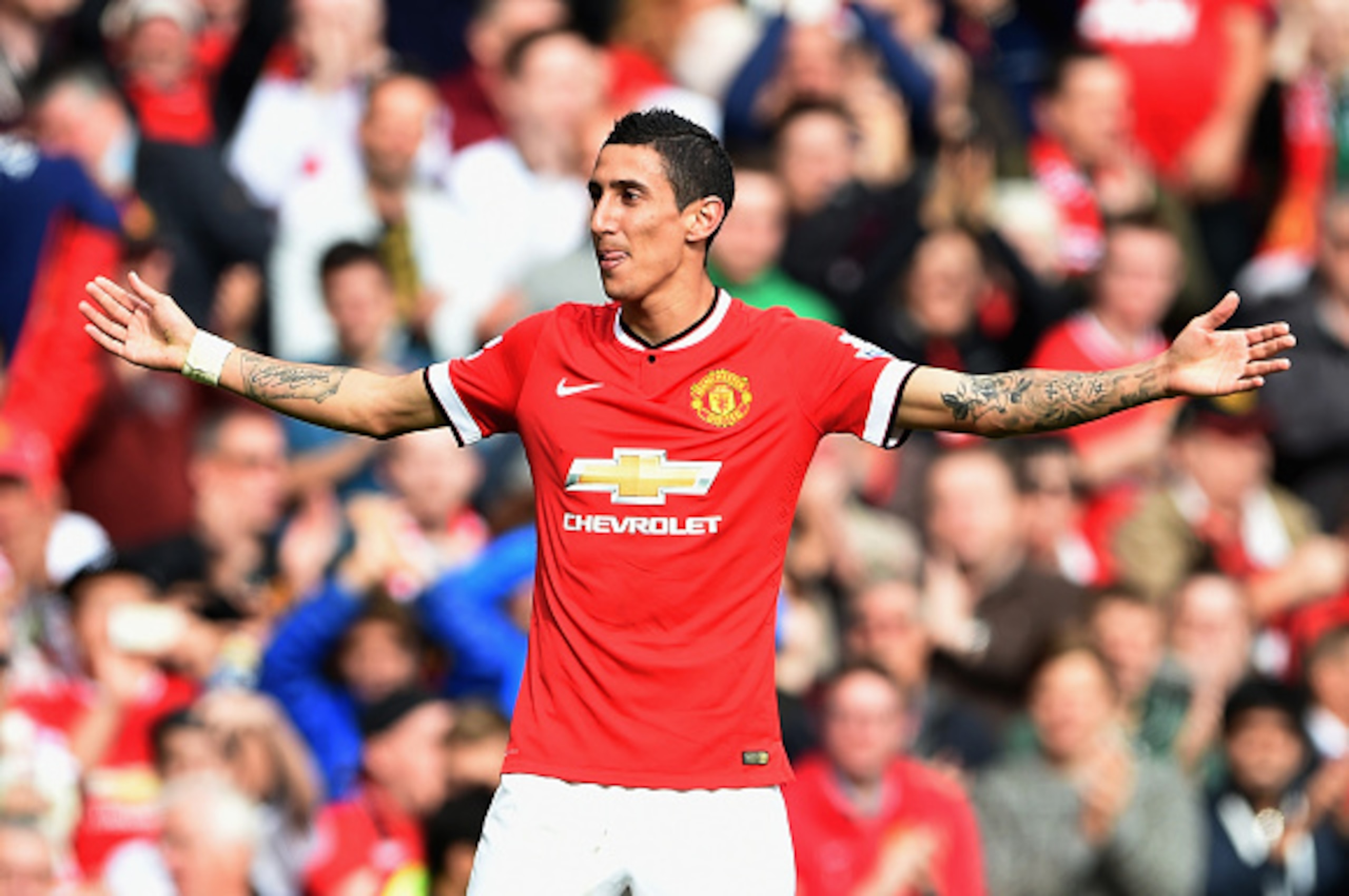 MANCHESTER, ENGLAND - OCTOBER 05:  Angel Di Maria of Manchester United celebrates scoring the first goal during the Barclays Premier League match between Manchester United and Everton at Old Trafford on October 5, 2014 in Manchester, England.  (Photo by M