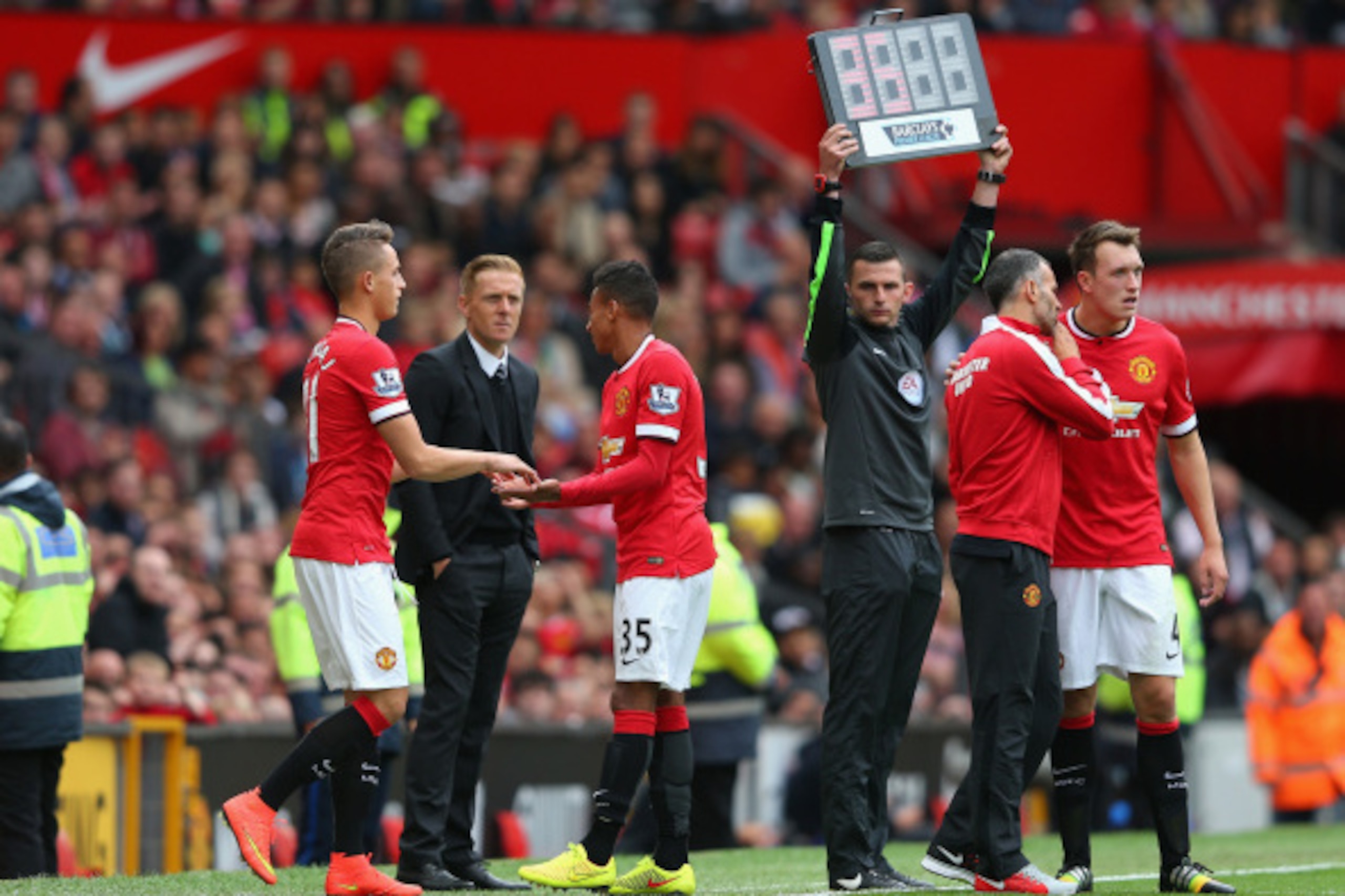 MANCHESTER, ENGLAND - AUGUST 16:  Jesse Lingard of Manchester United is replaced by Adnan Januzaj after sustaining an injury during the Barclays Premier League match between Manchester United and Swansea City at Old Trafford on August 16, 2014 in Manchest
