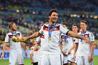 RIO DE JANEIRO, BRAZIL - JULY 13: Mats Hummels of Germany celebrates with the World Cup trophy after defeating Argentina 1-0 in extra time during the 2014 FIFA World Cup Brazil Final match between Germany and Argentina at Maracana on July 13, 2014 in Rio 
