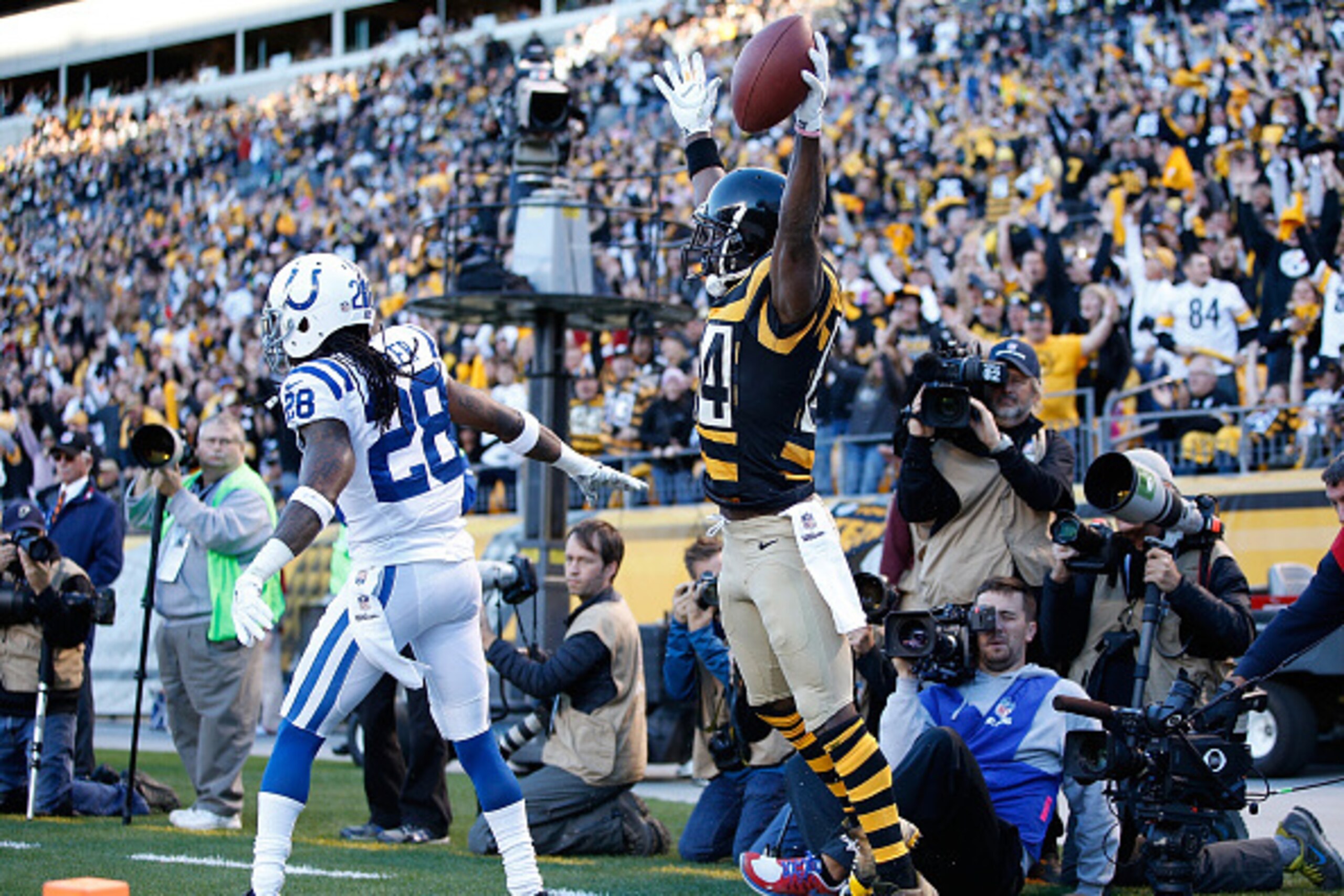 PITTSBURGH, PA - OCTOBER 26: Antonio Brown #84 of the Pittsburgh Steelers celebrates his touchdown catch in front of Greg Toler #28 of the Indianapolis Colts during the second quarter at Heinz Field on October 26, 2014 in Pittsburgh, Pennsylvania. (Phot PITTSBURGH, PA - OCTOBER 26: Antonio Brown #84 of the Pittsburgh Steelers celebrates his touchdown catch in front of Greg Toler #28 of the Indianapolis Colts during the second quarter at Heinz Field on October 26, 2014 in Pittsburgh, Pennsylvania. (Phot