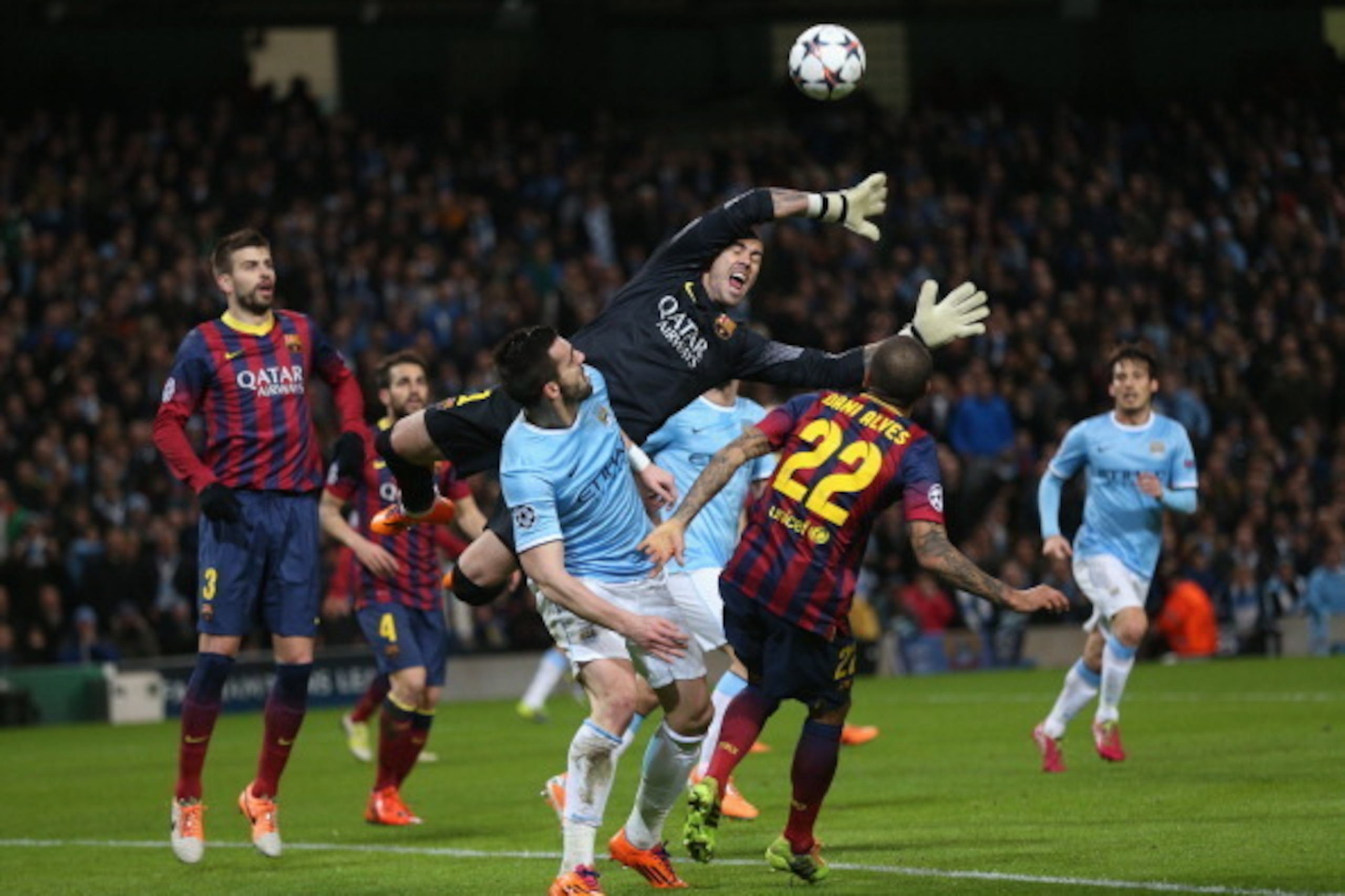 MANCHESTER, ENGLAND - FEBRUARY 18:  Victor Valdes of Barcelona rises to make a save under pressure during the UEFA Champions League Round of 16 first leg match between Manchester City and Barcelona at the Etihad Stadium on February 18, 2014 in Manchester,