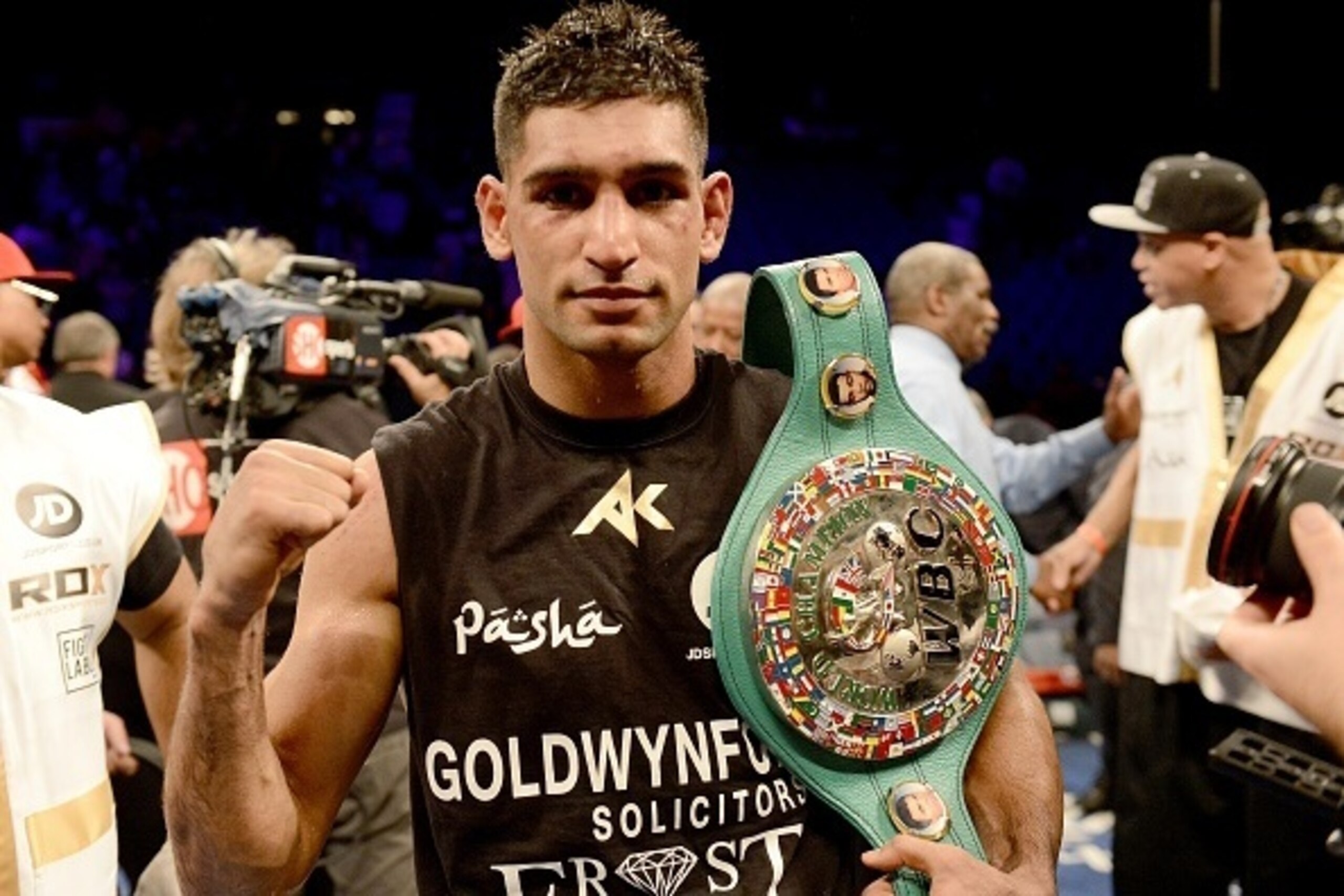 LAS VEGAS, NV-  DECEMBER 13:  Amir Khan celebrates his 12-round unanimous decision over Devon Alexander during their welterweight bout at the MGM Grand Garden Arena on December 13, 2014 in Las Vegas, Nevada. (Photo by Donald Miralle/Getty Images)
