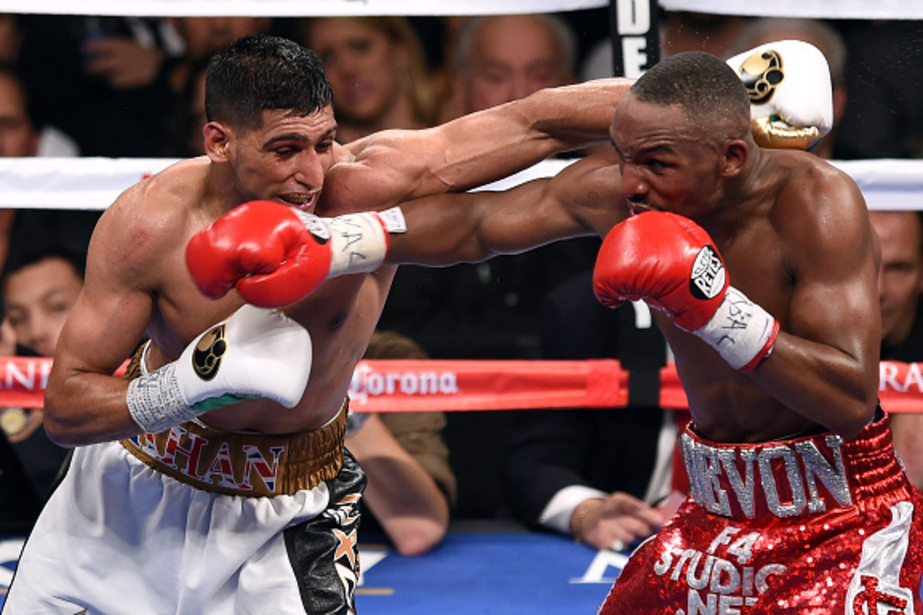 LAS VEGAS, NV - DECEMBER 13:  Amir Khan (L) and Devon Alexander battle in the eighth round of their welterweight bout at the MGM Grand Garden Arena on December 13, 2014 in Las Vegas, Nevada. Khan won by unanimous decision.  (Photo by Ethan Miller/Getty Im