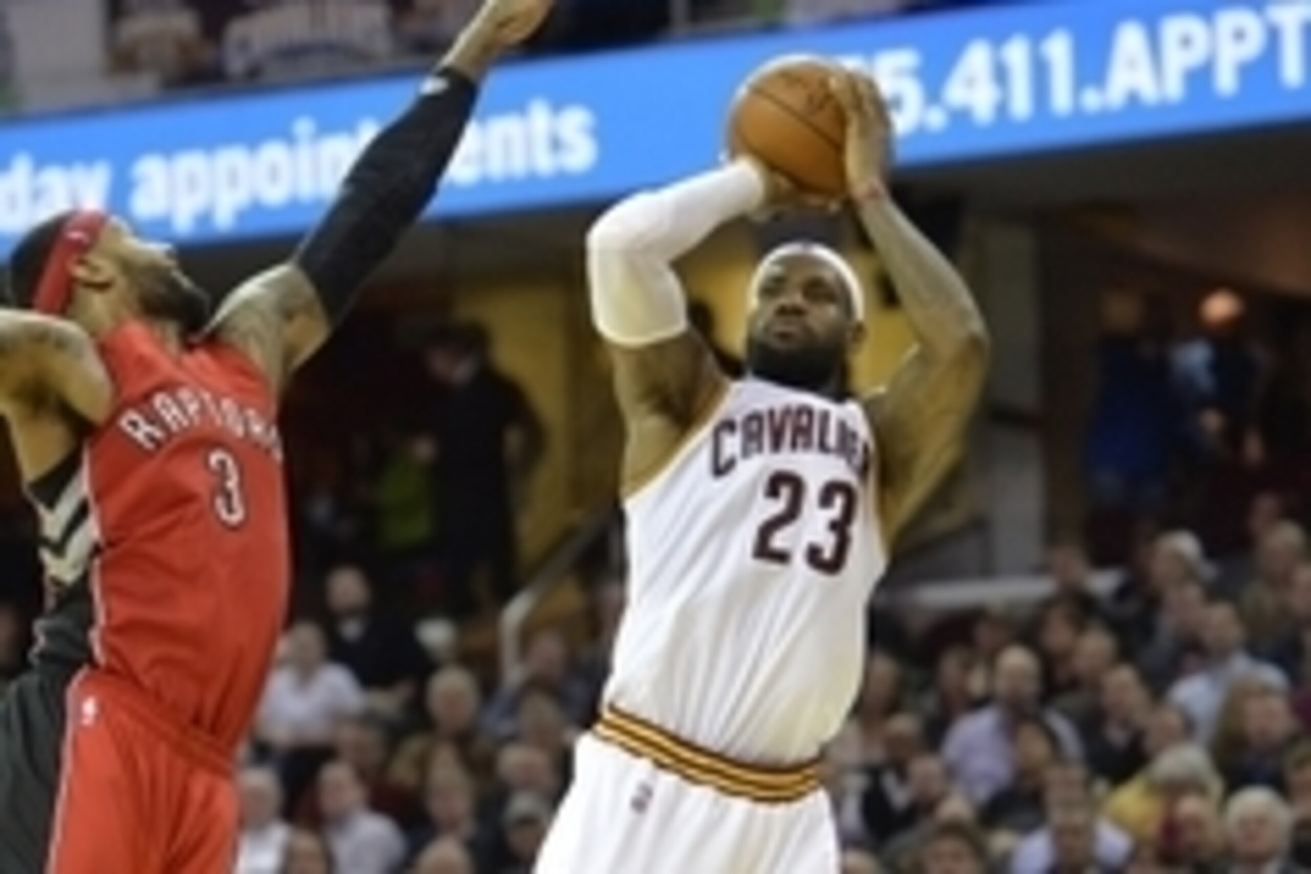 Dec 9, 2014; Cleveland, OH, USA; Cleveland Cavaliers forward LeBron James (23) shoots the ball in front of Toronto Raptors forward James Johnson (3) in the fourth quarter at Quicken Loans Arena. Mandatory Credit: David Richard-USA TODAY Sports Dec 9, 2014; Cleveland, OH, USA; Cleveland Cavaliers forward LeBron James (23) shoots the ball in front of Toronto Raptors forward James Johnson (3) in the fourth quarter at Quicken Loans Arena. Mandatory Credit: David Richard-USA TODAY Sports