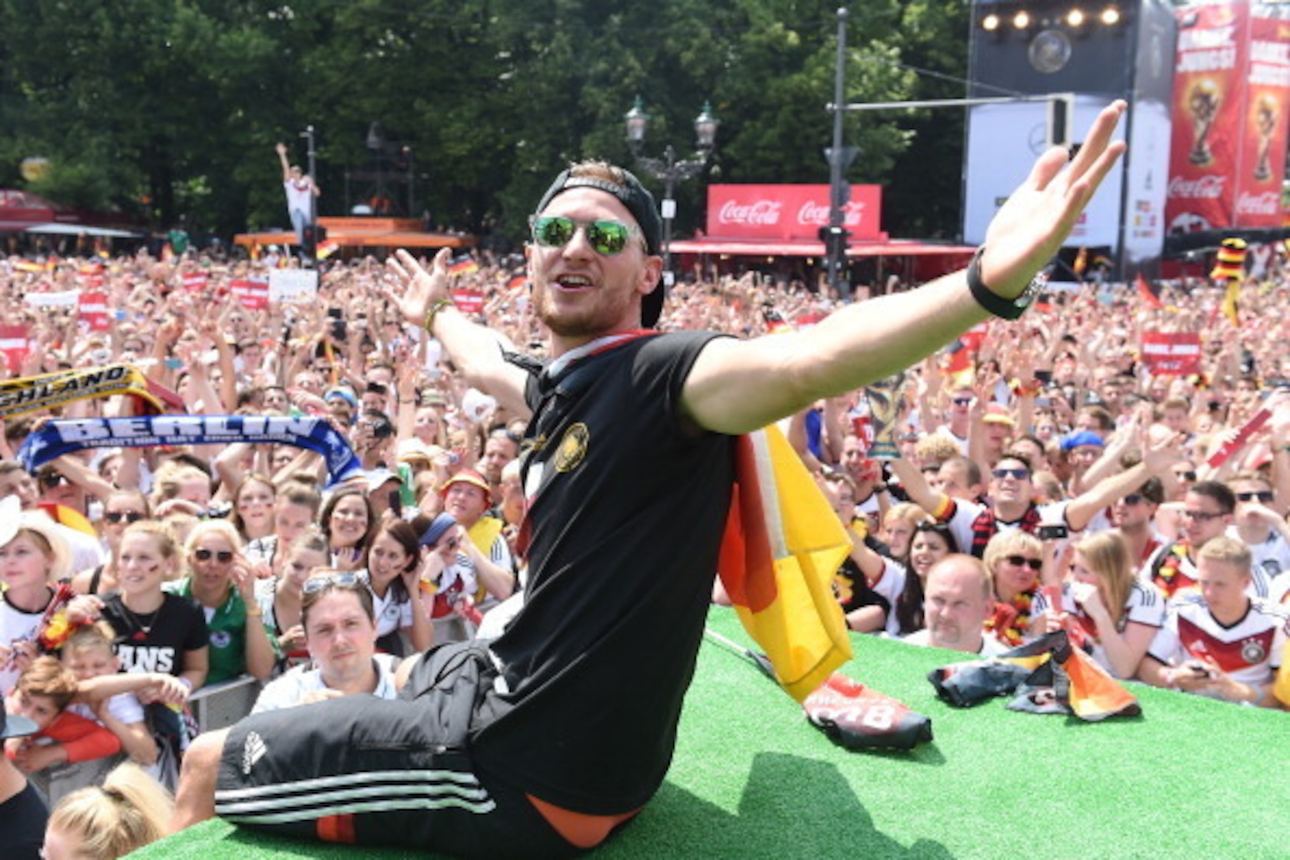 BERLIN, GERMANY - JULY 15: Benedikt Hoewedes celebrates during the German team victory ceremony on July 15, 2014 in Berlin, Germany. Germany won the 2014 FIFA World Cup Brazil match against Argentina in Rio de Janeiro on July 13.  (Photo by Markus Gilliar