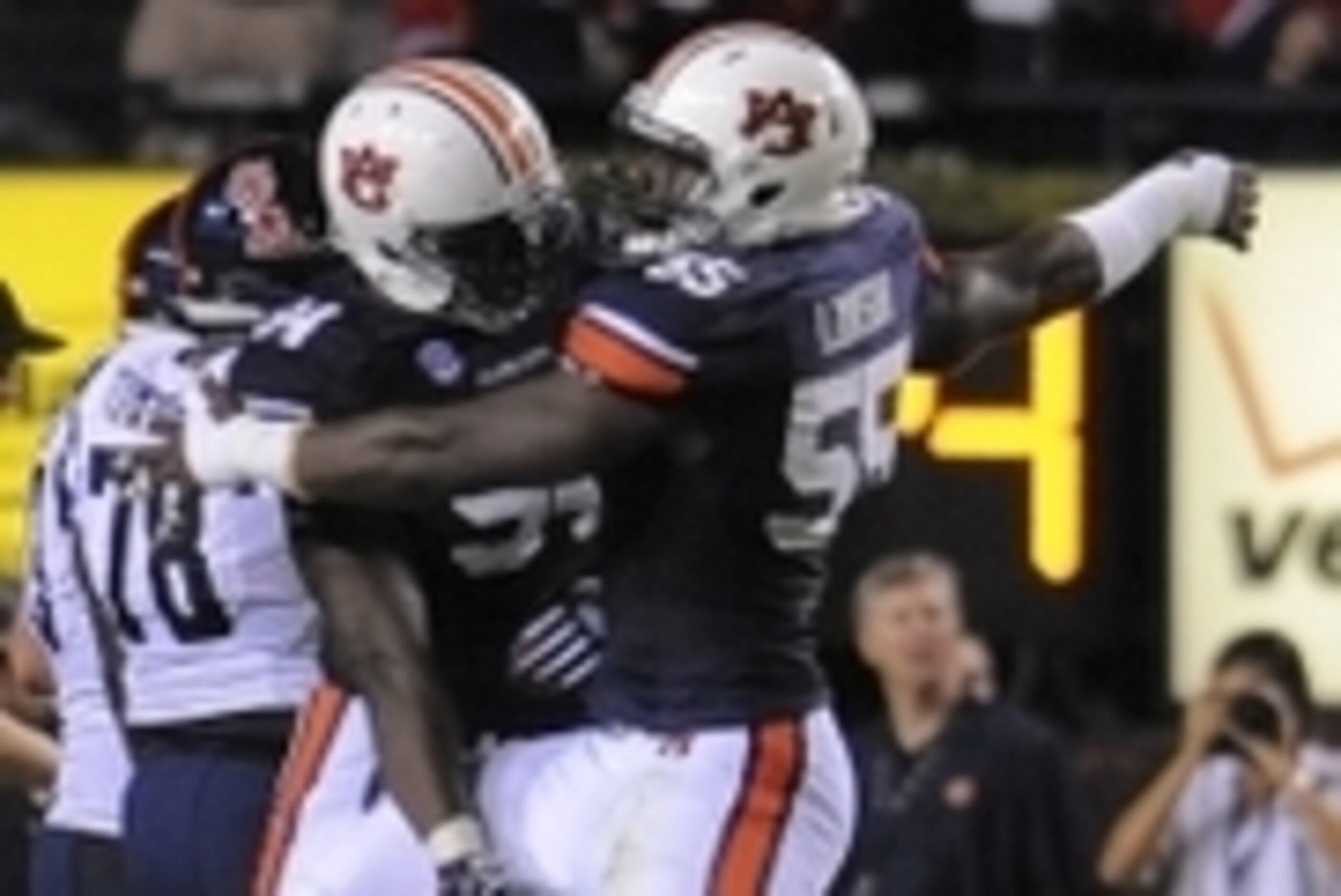 Oct 5, 2013; Auburn, AL, USA; Auburn Tigers defensive end Carl Lawson (55) and Auburn Tigers defensive end Nosa Eguae (94) celebrate a quarterback sack against the Mississippi Rebels at Jordan Hare Stadium. Mandatory Credit: Shanna Lockwood-USA TODAY Spor
