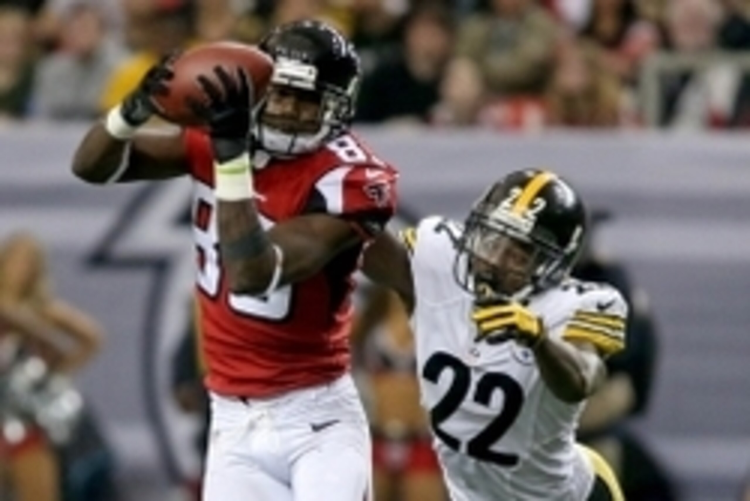 Dec 14, 2014; Atlanta, GA, USA; Atlanta Falcons wide receiver Harry Douglas (83) makes a catch in front of Pittsburgh Steelers cornerback William Gay (22) in the fourth quarter of their game at the Georgia Dome. The Steelers won 27-20. Mandatory Credit: J
