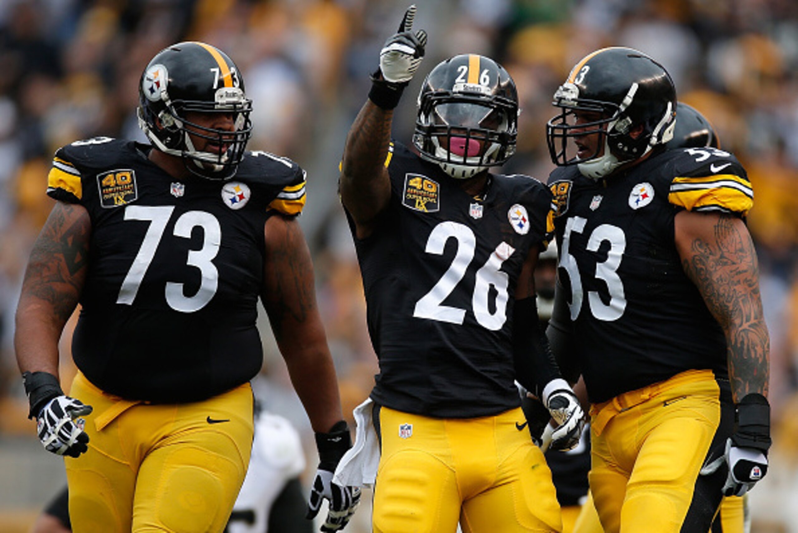 PITTSBURGH, PA - NOVEMBER 30:  Le'Veon Bell #26 reacts alongside Ramon Foster #73 and Maurkice Pouncey #53 of the Pittsburgh Steelers after picking up a first down during the first quarter against the New Orleans Saints at Heinz Field on November 30, 2014