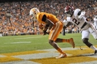 Oct 25, 2014; Knoxville, TN, USA; Tennessee Volunteers wide receiver Josh Malone (3) catches a touchdown pass against Alabama Crimson Tide defensive back Tony Brown (2) during the first half game at Neyland Stadium. Mandatory Credit: Jim Brown-USA TODAY S