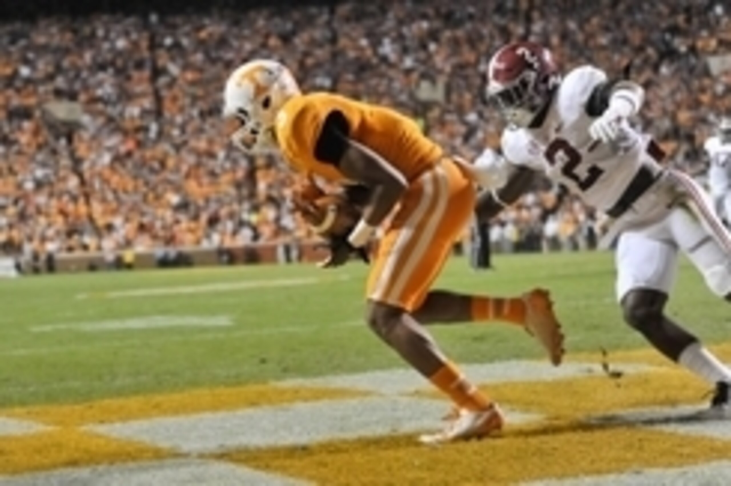 Oct 25, 2014; Knoxville, TN, USA; Tennessee Volunteers wide receiver Josh Malone (3) catches a touchdown pass against Alabama Crimson Tide defensive back Tony Brown (2) during the first half game at Neyland Stadium. Mandatory Credit: Jim Brown-USA TODAY S