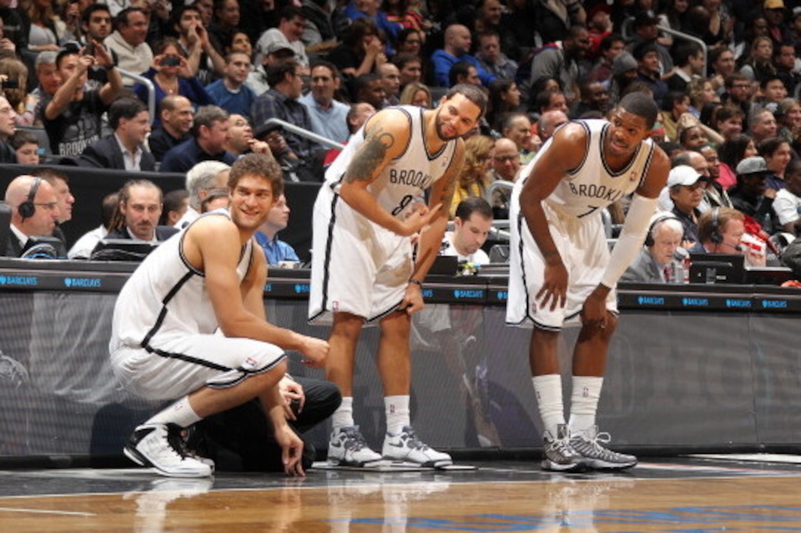 BROOKLYN, NY - JANUARY 5: Brook Lopez #11, Deron Williams #8 and Joe Johnson #7 of the Brooklyn Nets get ready to check in against the Sacramento Kings on January 5, 2013 at the Barclays Center in the Brooklyn borough of New York City.  NOTE TO USER: User
