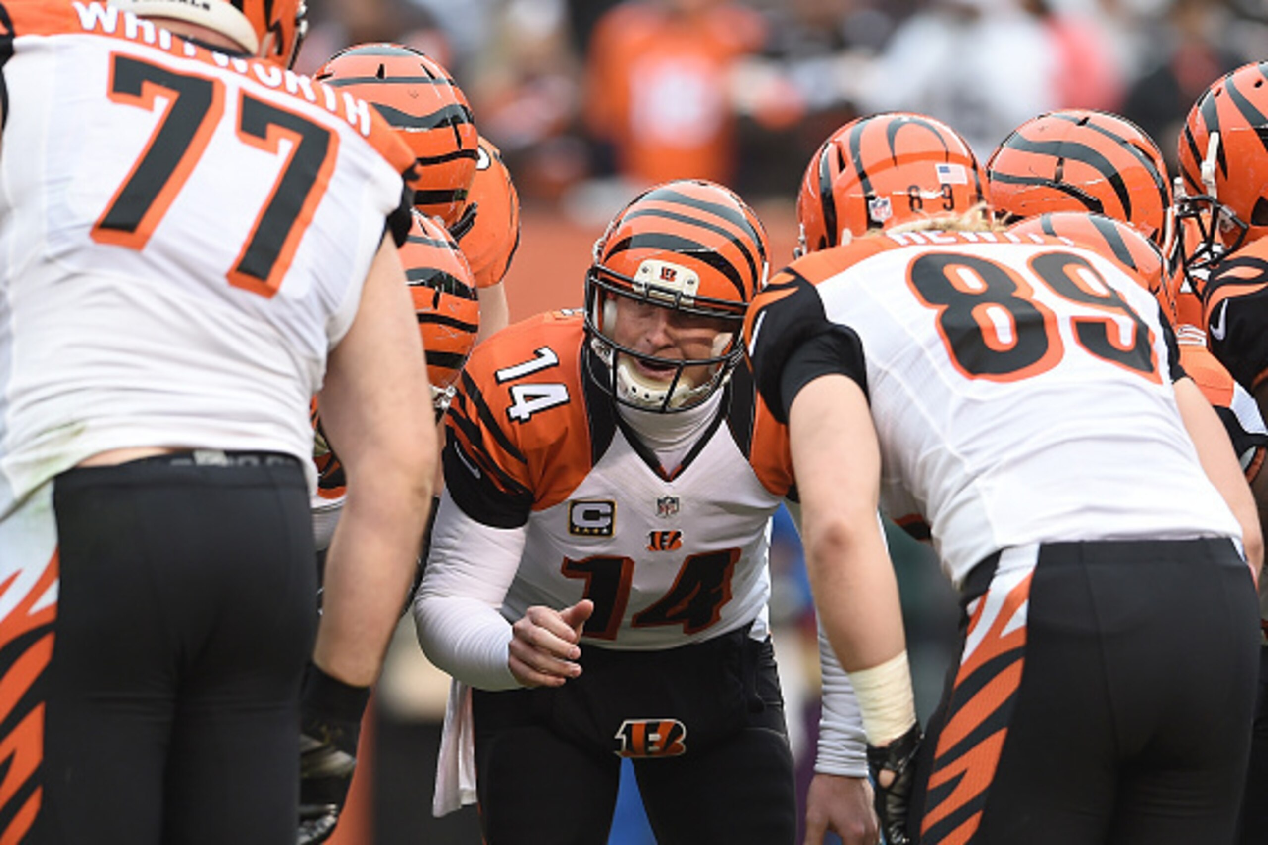 CLEVELAND, OH - DECEMBER 14:  Andy Dalton #14 of the Cincinnati Bengals talks to teammates in the huddle during the first quarter against the Cleveland Browns at FirstEnergy Stadium on December 14, 2014 in Cleveland, Ohio.  (Photo by Jason Miller/Getty Im