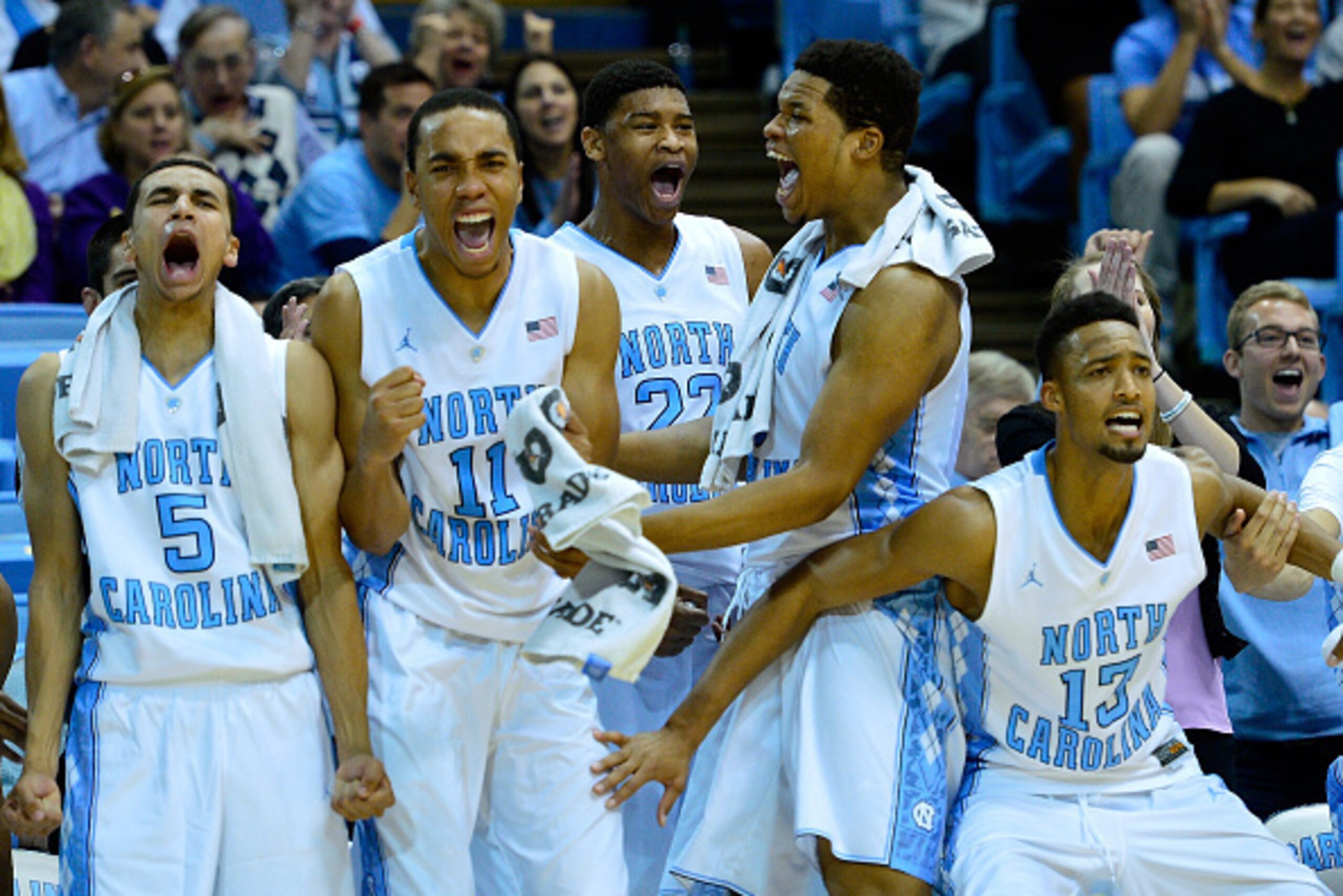 CHAPEL HILL, NC - DECEMBER 07:  (L-R) Marcus Paige #5, Brice Johnson #11, Isaiah Hicks #22, Kennedy Meeks #3 and J.P. Tokoto #13 of the North Carolina Tar Heels cheer on the reserves during the final minute of their game against the East Carolina Pirates 