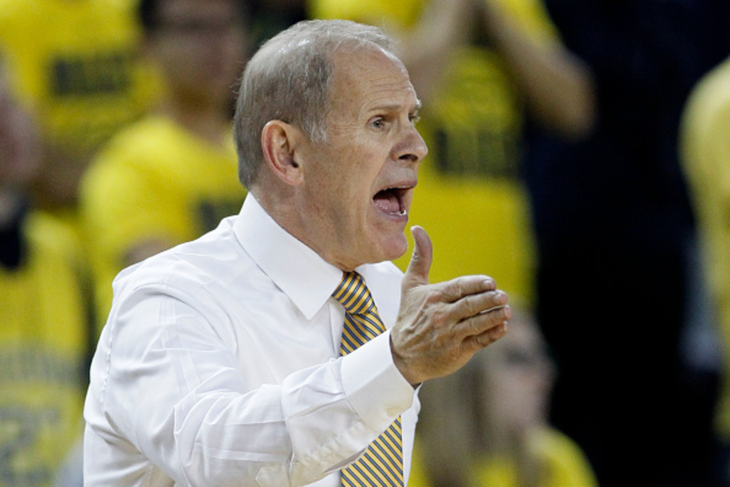 ANN ARBOR, MI - NOVEMBER 29:  Head coach John Beilein of the Michigan Wolverines shouts to his team during the second half of a 91-62 win over Nicholls State Colonels at Crisler Arena on November 29, 2014 in Ann Arbor, Michigan. (Photo by Duane Burleson/G