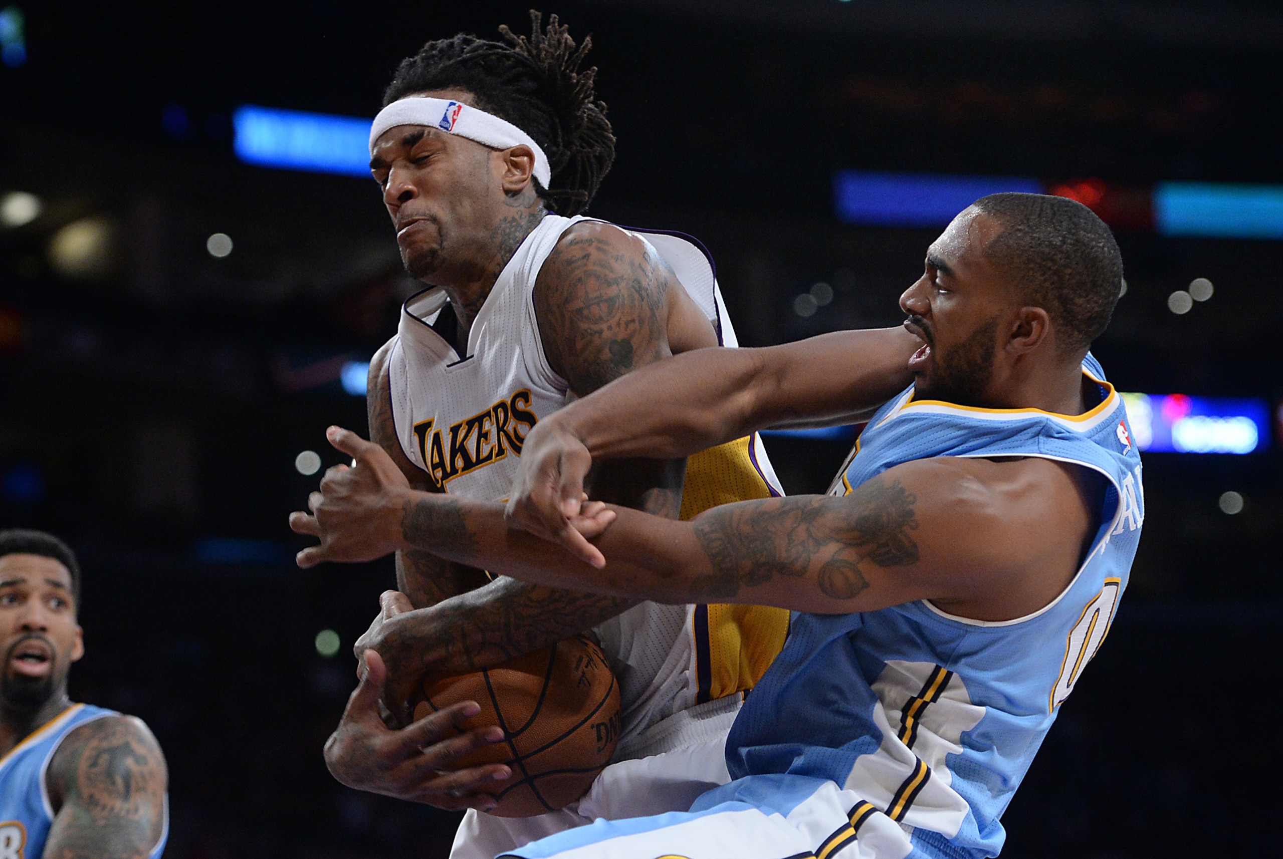 Nov 23, 2014; Los Angeles, CA, USA;  Los Angeles Lakers center Jordan Hill (27) and Denver Nuggets forward Darrell Arthur (00) battle for a rebound in the second half of the game at Staples Center. Nuggets won 101-94. Mandatory Credit: Jayne Kamin-Oncea-U