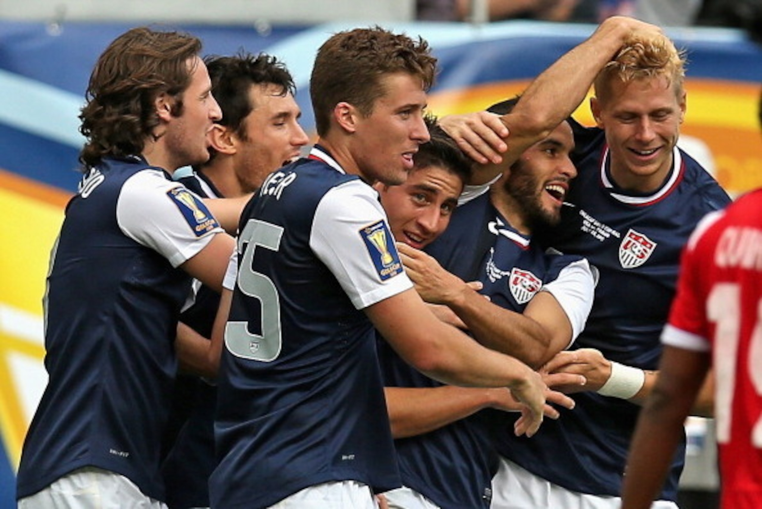 CHICAGO, IL - JULY 28: Members of the United States including Michael Parkhurst #15 and Landon Donovan #10 celebrate with Brek Shea #23 (R) after Shea scored the game-winning goal against Panama during the CONCACAF Gold Cup final match at Soldier Field on