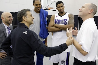 Kings owner Vivek Ranadive (second from left) reportedly had significant differences with head coach Michael Malone, who was fired Sunday night.