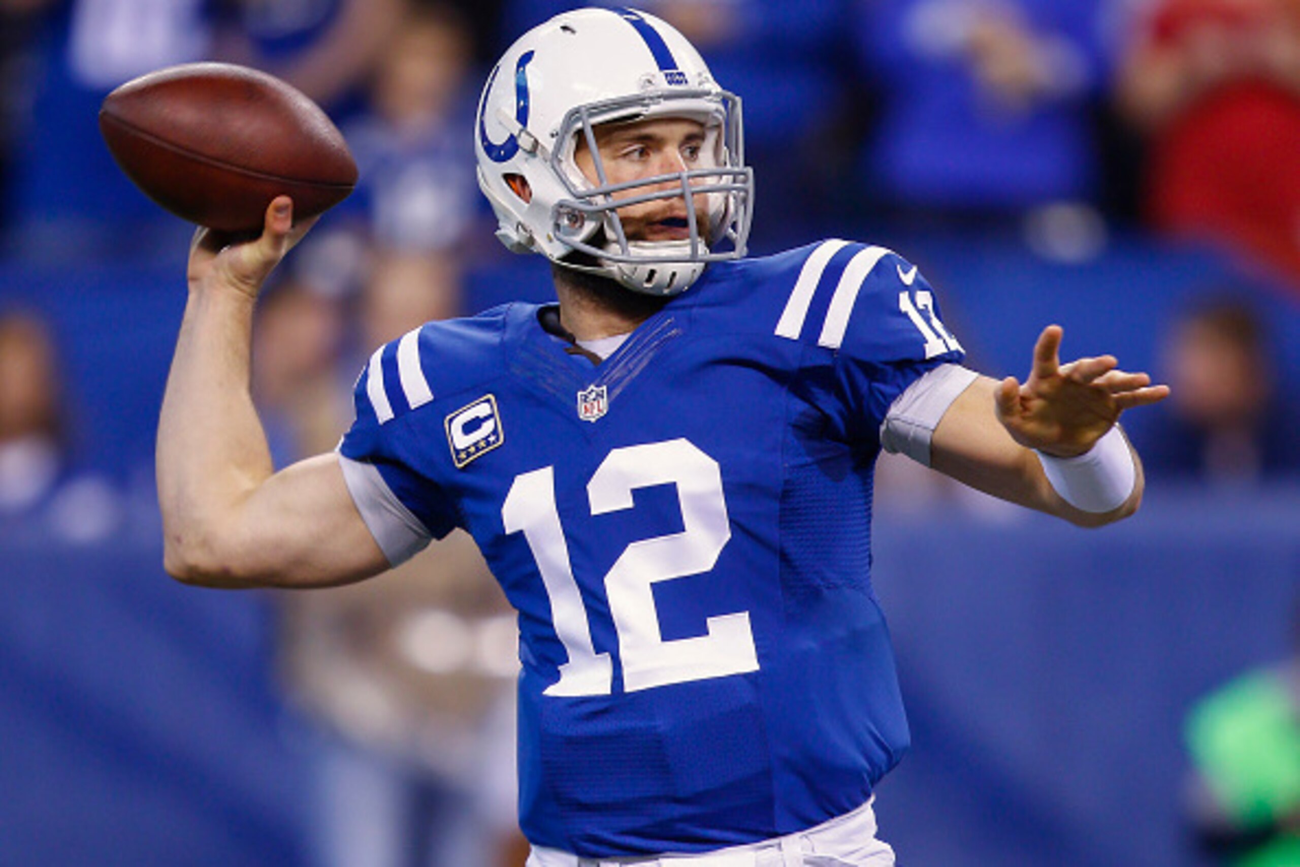 INDIANAPOLIS, IN - DECEMBER  14: Andrew Luck #12 of the Indianapolis Colts drops back to pass during the game against the Houston Texans at Lucas Oil Stadium on December 14, 2014 in Indianapolis, Indiana. (Photo by Michael Hickey/Getty Images)