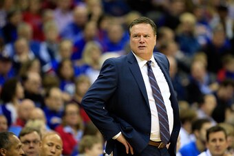 KANSAS CITY, MO - DECEMBER 13:  Head coach Bill Self of the Kansas Jayhawks coaches from the bench during the game against the Utah Utes at the Sprint Center on December 13, 2014 in Kansas City, Missouri.  (Photo by Jamie Squire/Getty Images)