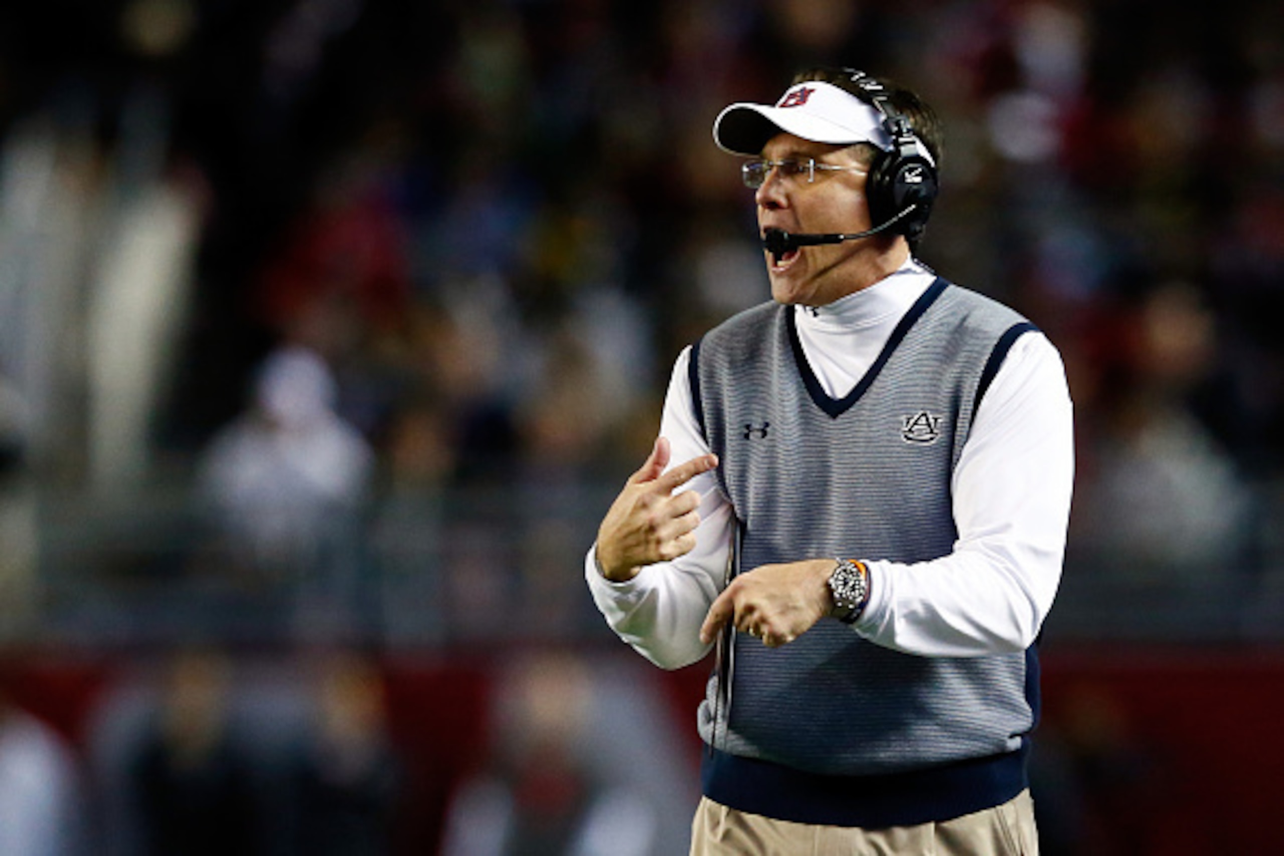 TUSCALOOSA, AL - NOVEMBER 29:  Head coach Gus Malzahn of the Auburn Tigers shouts in the first quarter during the Iron Bowl against the Alabama Crimson Tide at Bryant-Denny Stadium on November 29, 2014 in Tuscaloosa, Alabama.  (Photo by Kevin C. Cox/Getty