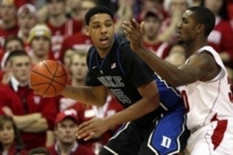 Dec 3, 2014; Madison, WI, USA; Duke Blue Devils center Jahlil Okafor (15) attempts to moves the ball against Wisconsin Badgers forward Vitto Brown (30) at the Kohl Center. Duke defeated Wisconsin 80-70.  Mandatory Credit: Mary Langenfeld-USA TODAY Sports