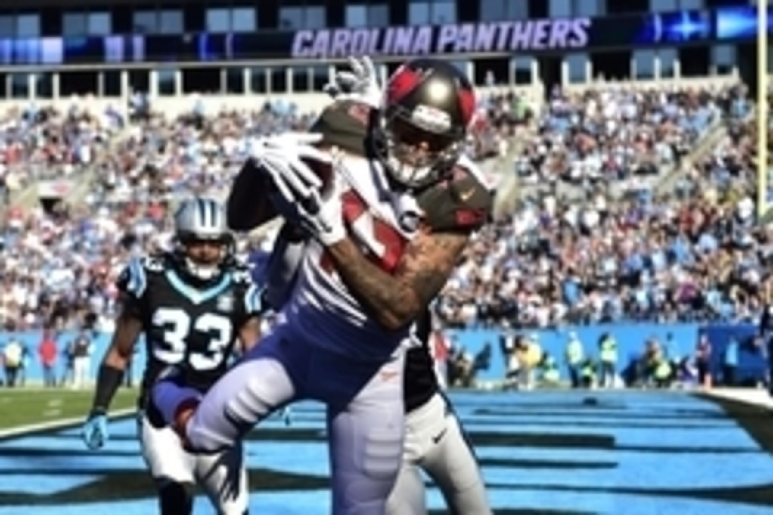 Dec 14, 2014; Charlotte, NC, USA; Tampa Bay Buccaneers wide receiver Mike Evans (13) catches a touchdown as Carolina Panthers free safety Tre Boston (33) and cornerback Josh Norman (24) defend in the first quarter at Bank of America Stadium. Mandatory Cre