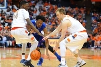Dec 14, 2014; Syracuse, NY, USA; Syracuse Orange guard Kaleb Joseph (L),  guard Trevor Cooney (R), and Louisiana Tech Bulldogs guard Raheem Appleby (C) battle for the ball during the second half at the Carrier Dome.  The Orange won 71-69.  Mandatory Credi