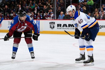 DENVER, CO - DECEMBER 13:  Jarome Iginla #12 of the Colorado Avalanche talks to Maxim Lapierre #40 of the St. Louis Blues as they await a face off at Pepsi Center on December 13, 2014 in Denver, Colorado. The Blues defeated the Avalanche 3-2 in overtime.