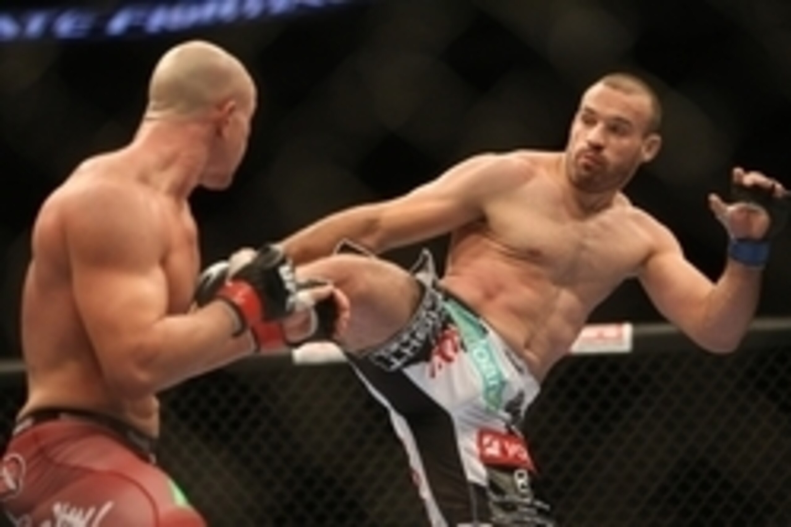 Jun 15, 2013; Winnipeg, MB, Canada; Igor Pokrajac (right) fights against Ryan Jimmo during their light heavyweight bout at UFC 161 at MTS Centre. Mandatory Credit: Tom Szczerbowski-USA TODAY Sports