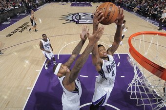SACRAMENTO, CA - NOVEMBER 15:  Rudy Gay #8 and DeMarcus Cousins #15 of the Sacramento Kings grab the rebound against the San Antonio Spurs at Sleep Train Arena on November 15, 2014 in Sacramento, California. NOTE TO USER: User expressly acknowledges and a