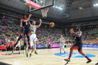 BARCELONA, SPAIN - SEPTEMBER 9: Rudy Gay #8 passes to DeMarcus Cousins #12 of the USA Basketball Men's National Team against the Slovenia National Team during the 2014 FIBA World Cup quarter-finals at Palau Sant Jordi on September 9, 2014 in Barcelona, Sp