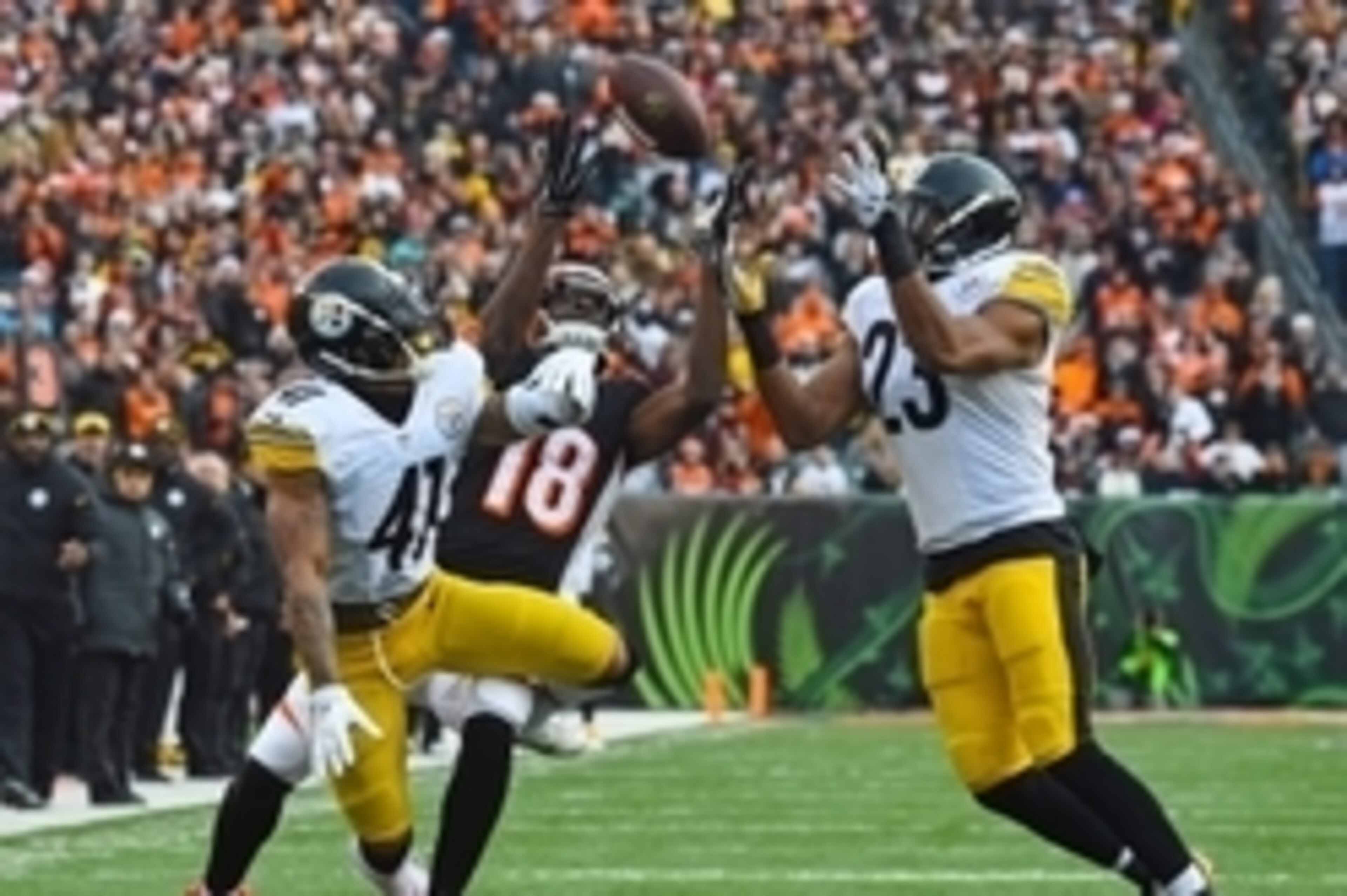 Dec 7, 2014; Cincinnati, OH, USA; Cincinnati Bengals wide receiver A.J. Green (18) attempts to make a catch against Pittsburgh Steelers defensive back Antwon Blake (41) and free safety Mike Mitchell (23) during the second half at Paul Brown Stadium. Pitts Dec 7, 2014; Cincinnati, OH, USA; Cincinnati Bengals wide receiver A.J. Green (18) attempts to make a catch against Pittsburgh Steelers defensive back Antwon Blake (41) and free safety Mike Mitchell (23) during the second half at Paul Brown Stadium. Pitts