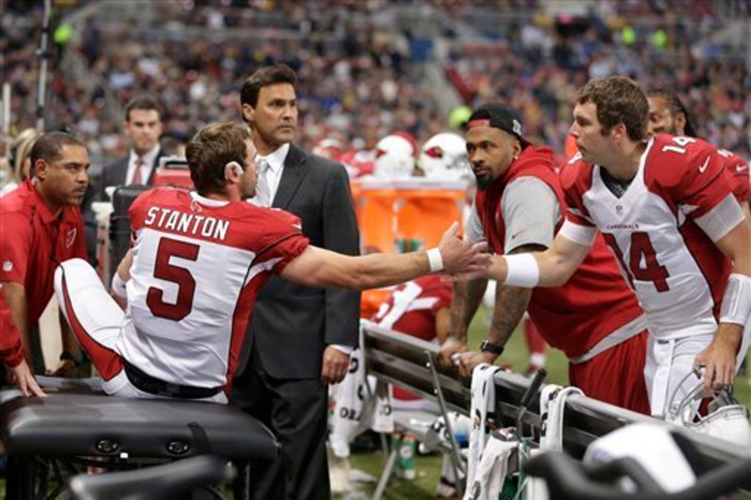 Arizona Cardinals third-string quarterback Ryan Lindley (No. 14) shakes the hand of injured No. 2 man Drew Stanton.