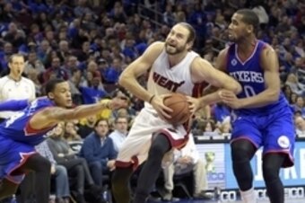 Nov 1, 2014; Philadelphia, PA, USA; Miami Heat forward Josh McRoberts (4) drives past Philadelphia 76ers forward Brandon Davies (0) and guard K.J. McDaniels (14) during the second half at Wells Fargo Center. The Heat defeated the 76ers, 114-96. Mandatory 