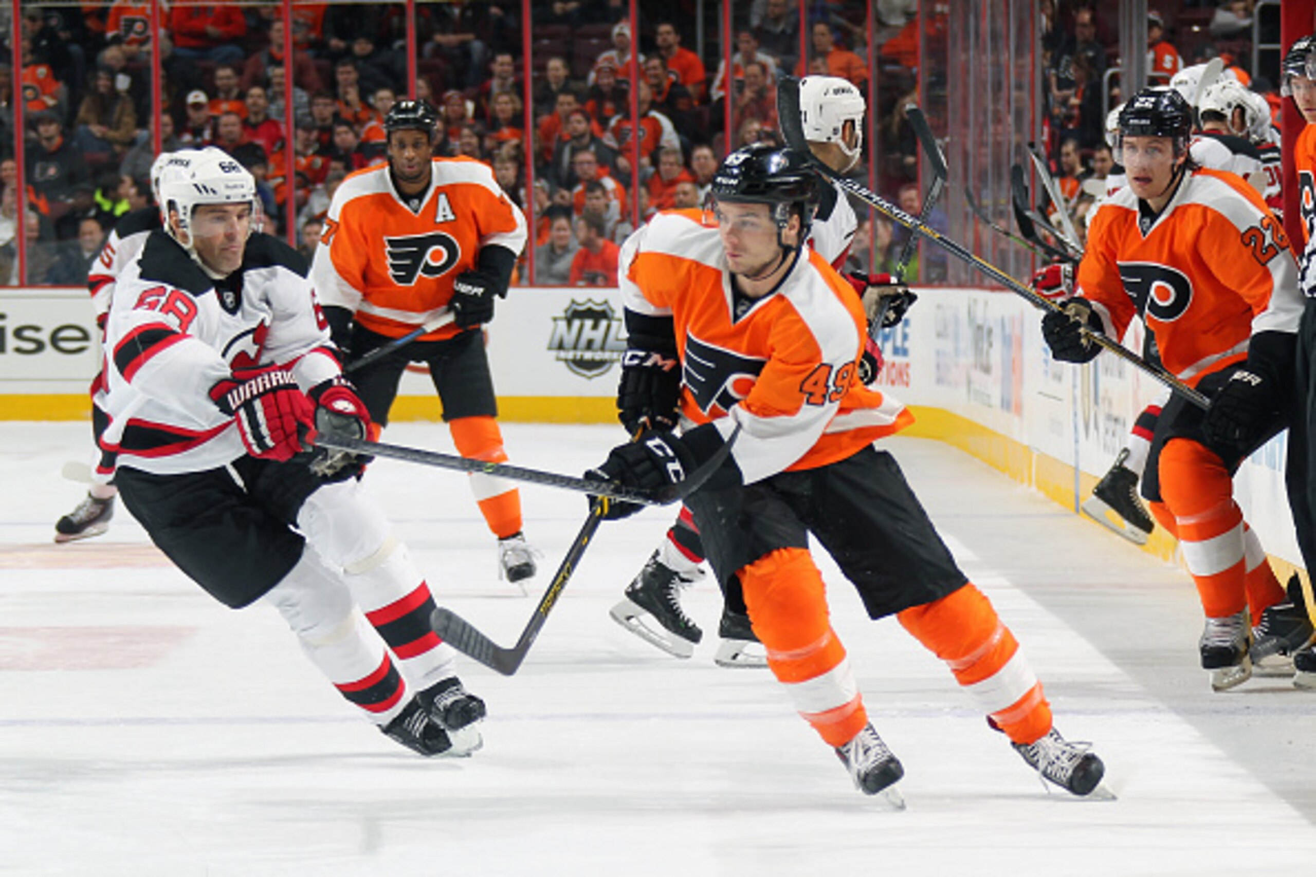 PHILADELPHIA, PA - DECEMBER 11:  Scott Laughton #49, Luke Schenn #22 and Wayne Simmonds #17 of the Philadelphia Flyers in action against Jaromir Jagr #68 of the New Jersey Devils on December 11, 2014 at the Wells Fargo Center in Philadelphia, Pennsylvania