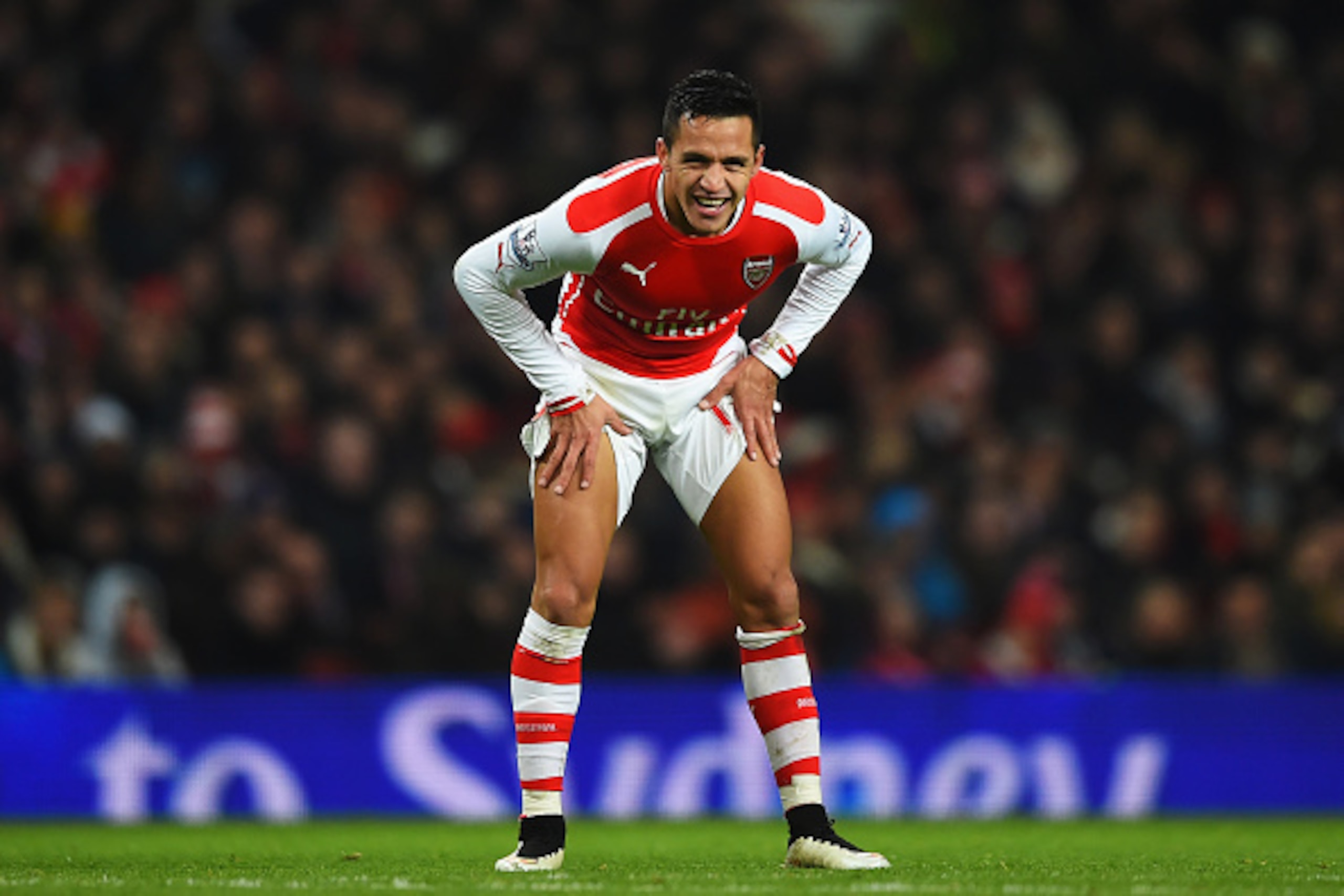 LONDON, ENGLAND - DECEMBER 13:  Alexis Sanchez of Arsenal takes a breather during the Barclays Premier League match between Arsenal and Newcastle United at Emirates Stadium on December 13, 2014 in London, England.  (Photo by Paul Gilham/Getty Images)