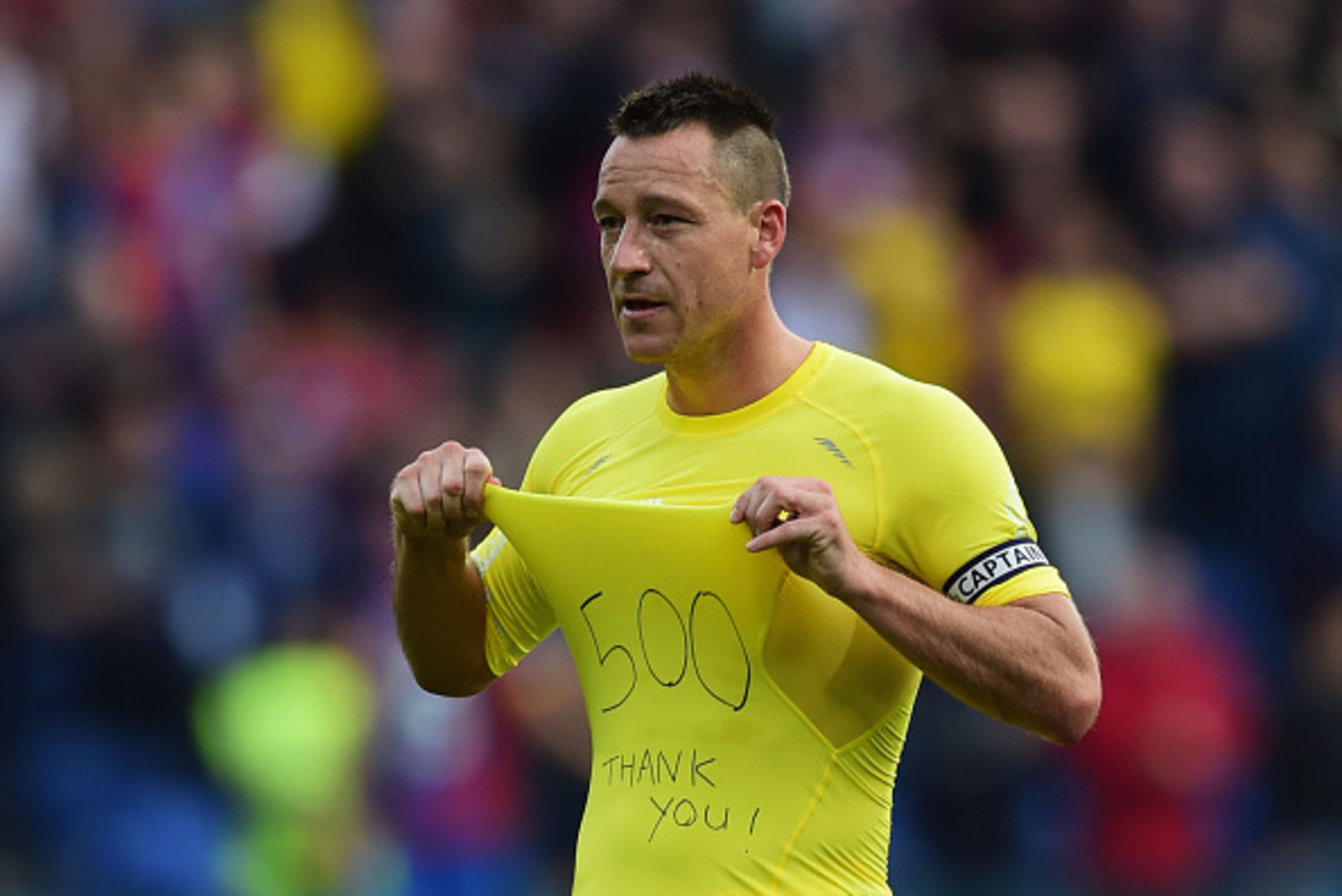 LONDON, ENGLAND - OCTOBER 18:  John Terry of Chelsea salutes the travelling fans after his 500th match as captain after the Barclays Premier League match between Crystal Palace and Chelsea at Selhurst Park on October 18, 2014 in London, England.  (Photo b