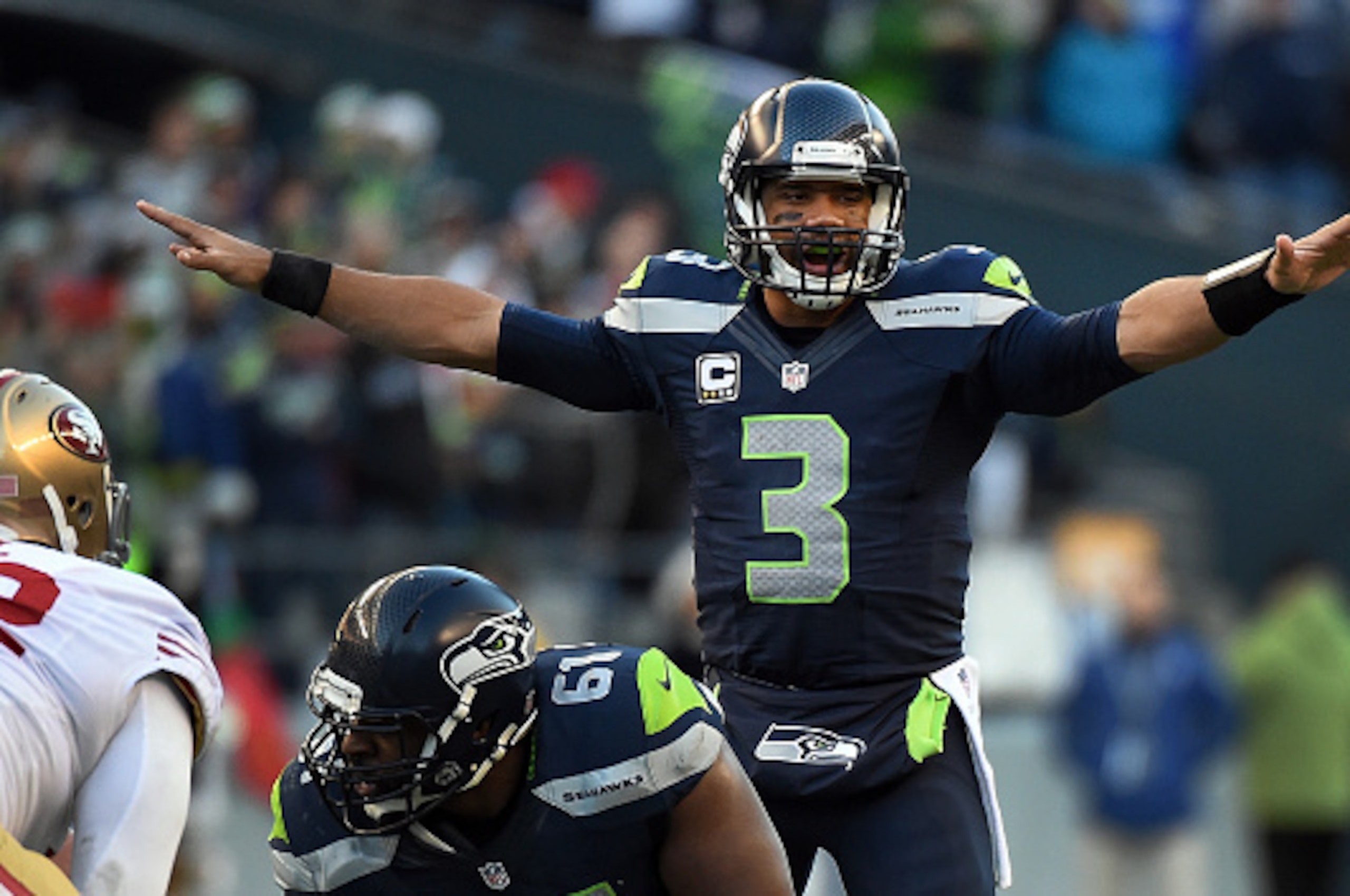 SEATTLE, WA - DECEMBER 14: Quarterback Russell Wilson #3 of the Seattle Seahawks calls out a play during the third quarter of the game against the San Francisco 49ers at CenturyLink Field on December 14, 2014 in Seattle, Washington. (Photo by Steve Dykes/