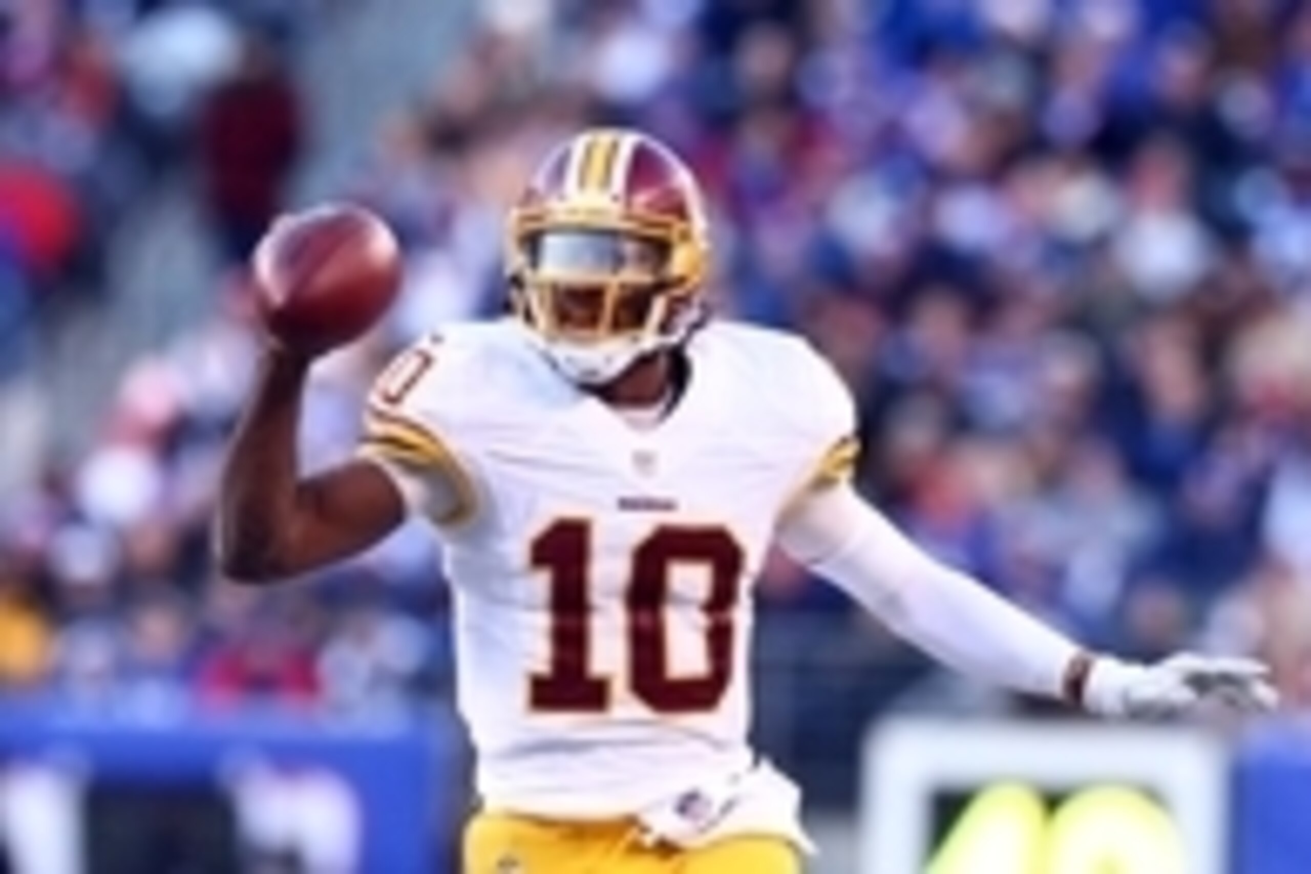 Dec 14, 2014; East Rutherford, NJ, USA; Washington Redskins quarterback Robert Griffin III (10) scrambles against the New York Giants during the third quarter of a game at MetLife Stadium. Mandatory Credit: Brad Penner-USA TODAY Sports