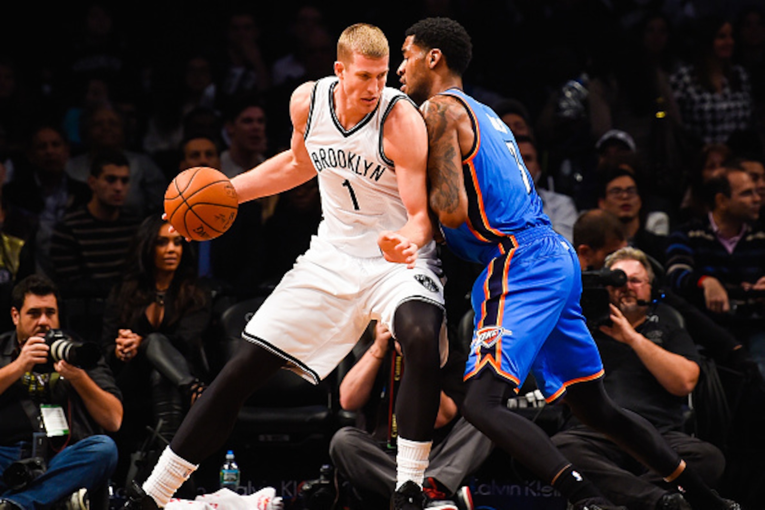 NEW YORK, NY - NOVEMBER 03: Mason Plumlee #1 of the Brooklyn Nets drives against Perry Jones #3 of the Oklahoma City Thunder in the first half at the Barclays Center on November 3, 2014 in the Brooklyn borough of New York City. NOTE TO USER: User expressl