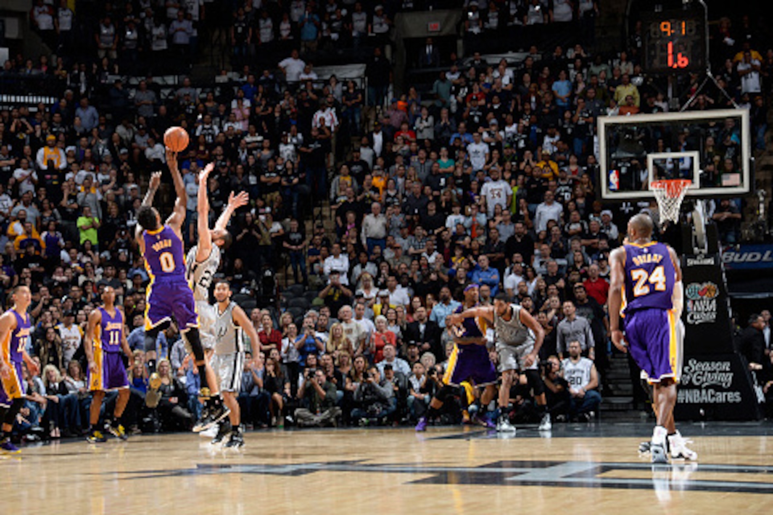 SAN ANTONIO - DECEMBER 12: Nick Young #0 of the Los Angeles Lakers takes a shot in the final seconds of OT to win the game against the San Antonio Spurs at the AT&T Center on December 12, 2014 in San Antonio, Texas. NOTE TO USER: User expressly acknowledg SAN ANTONIO - DECEMBER 12: Nick Young #0 of the Los Angeles Lakers takes a shot in the final seconds of OT to win the game against the San Antonio Spurs at the AT&T Center on December 12, 2014 in San Antonio, Texas. NOTE TO USER: User expressly acknowledg
