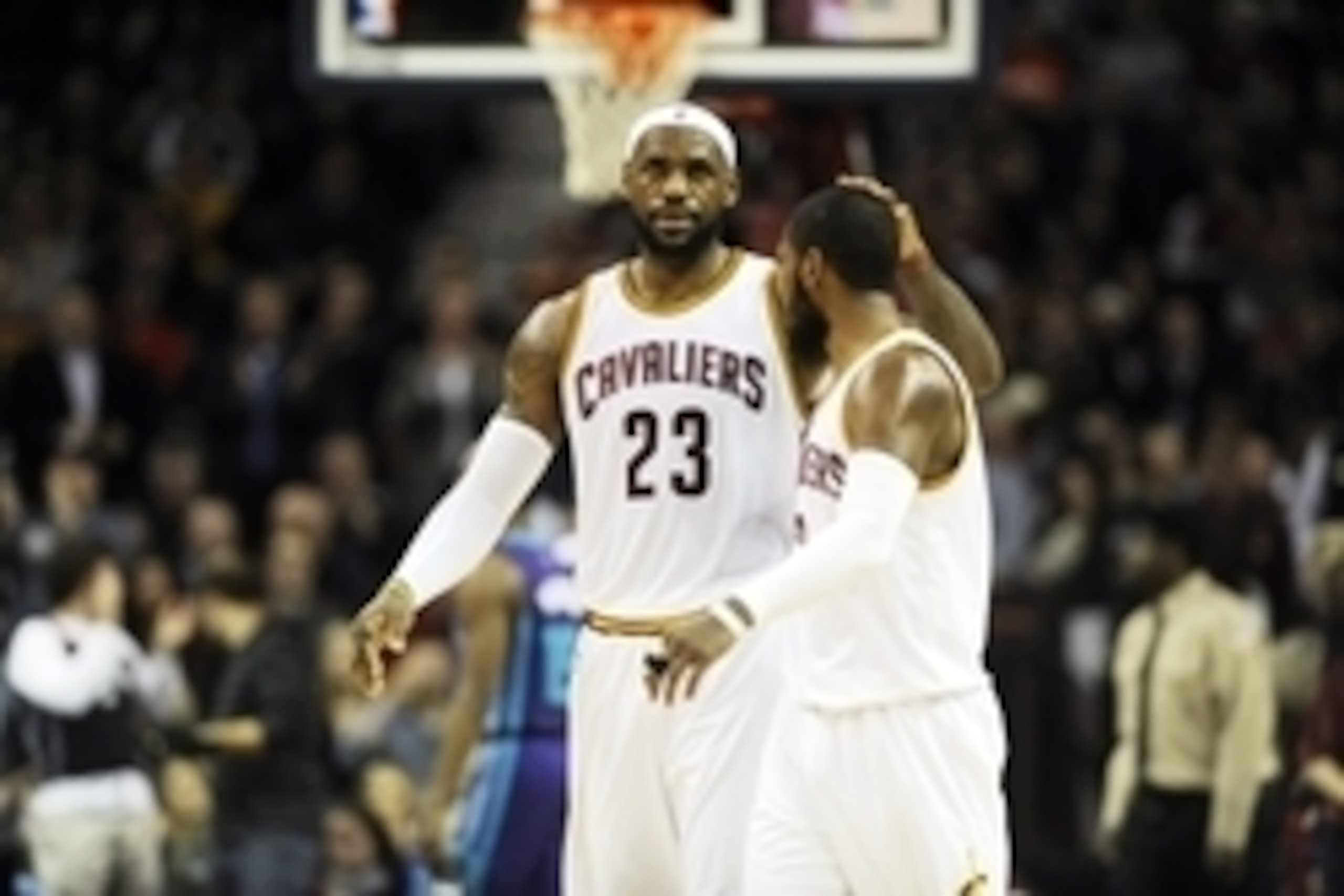 Dec 15, 2014; Cleveland, OH, USA; Cleveland Cavaliers forward LeBron James (23) celebrates with Cleveland Cavaliers guard Kyrie Irving (2) after a play during the second quarter against the Charlotte Hornets at Quicken Loans Arena.  The Cavs beat the Horn