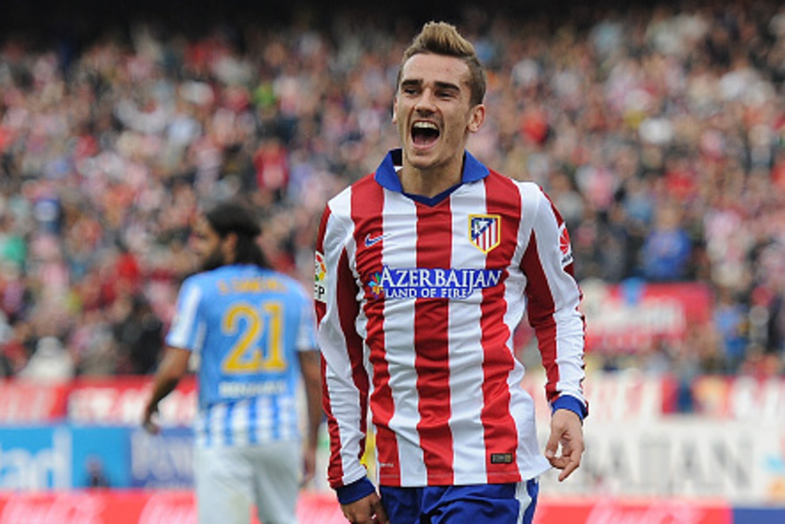 MADRID, SPAIN - NOVEMBER 22:  Antoine Griezmann of Club Atletico de Madrid celebrates after scoring his team's 2nd goal during the La Liga match between Club Atletico de Madrid and Malaga CF at Vicente Calderon Stadium on November 22, 2014 in Madrid, Spai