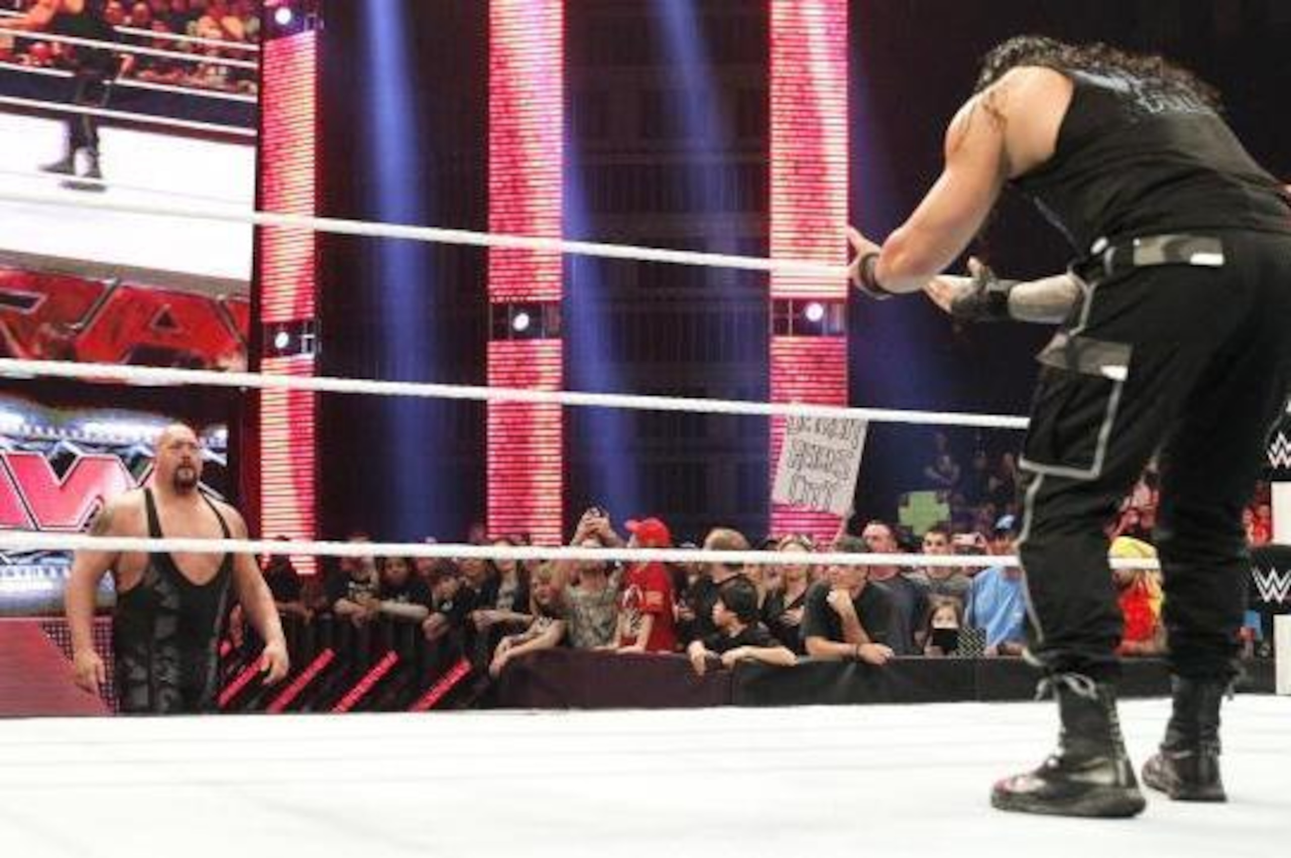 Roman Reigns challenges Big Show to step into the ring.